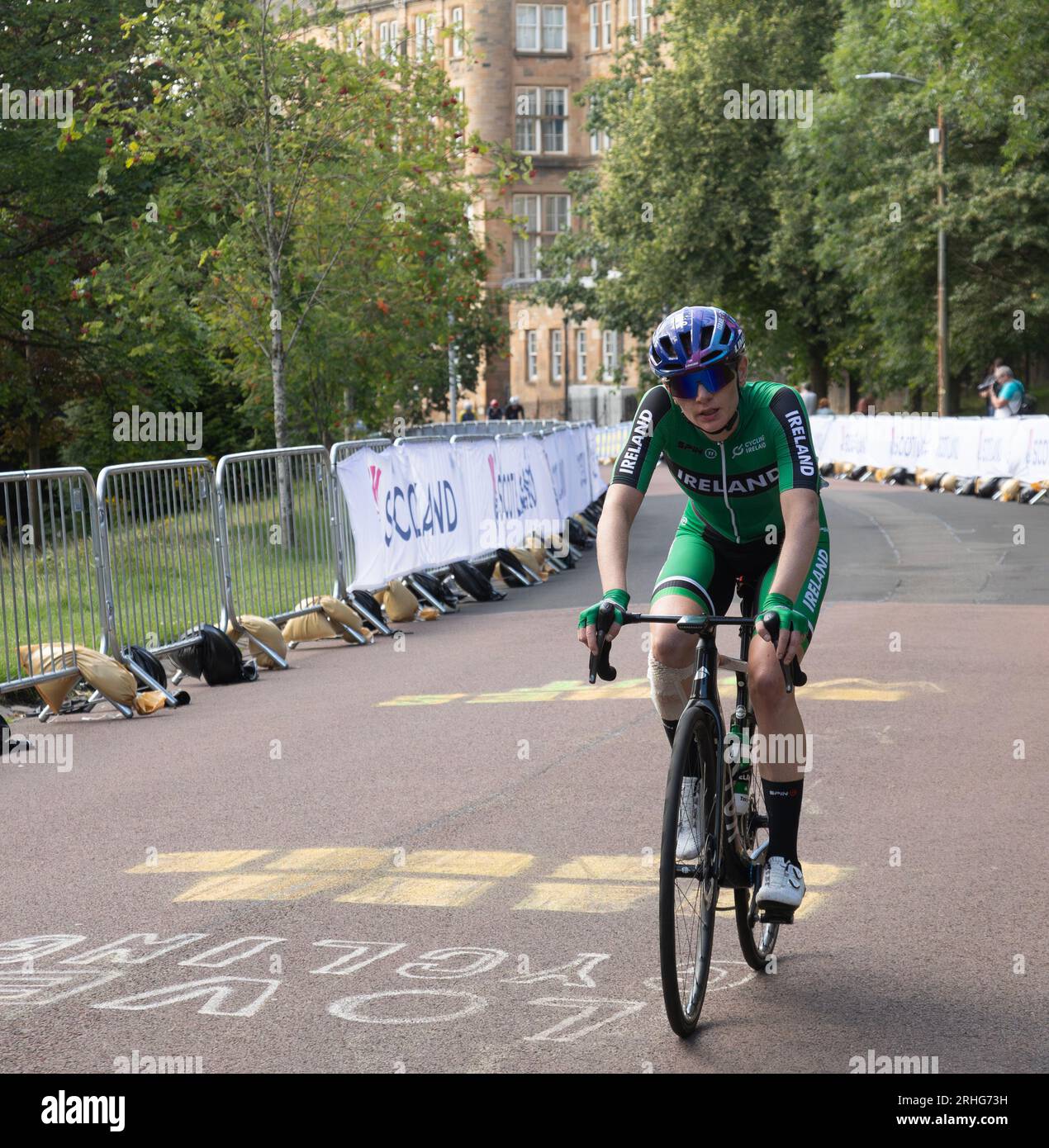 Alice Sharpe of Ireland rides over a chalk sign saying 'Love Cycling' while competing in the UCI elite women's world championship road race 2023. Stock Photo