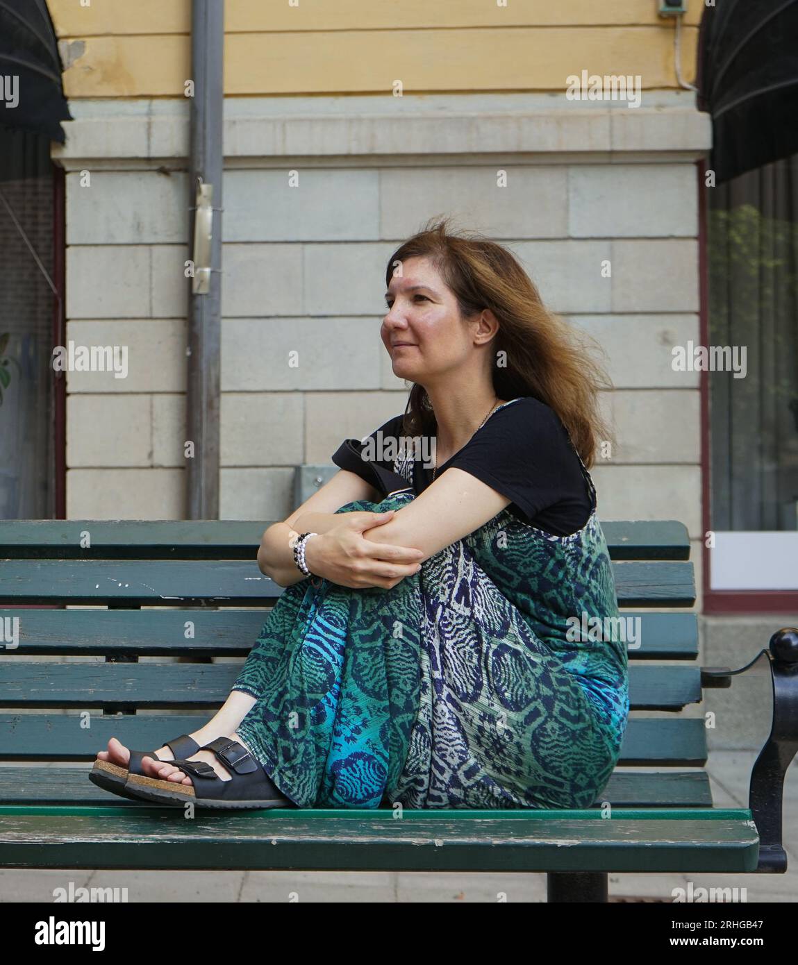 A woman standing in front a school building Stock Photo - Alamy