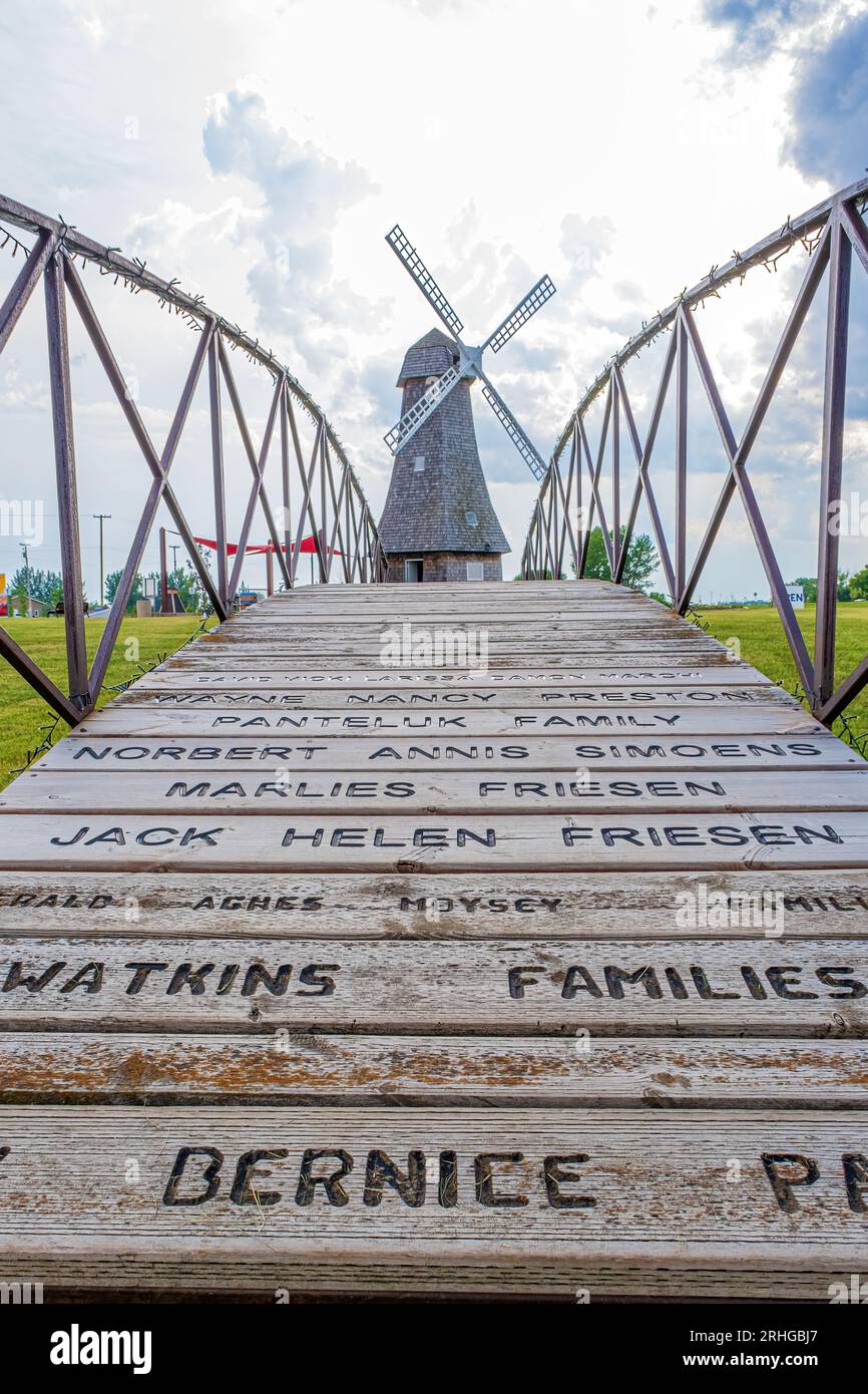 The residents of Holland Manitoba build a working replica windmill as a tribute to the country where their name originated.  The bridge leading to the Stock Photo