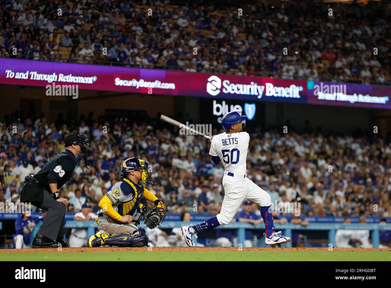 Los Angeles Dodgers second basemen Mookie Betts (50) swings the bat during a regular season game between the Milwaukee Brewers and Los Angeles Dodgers Stock Photo