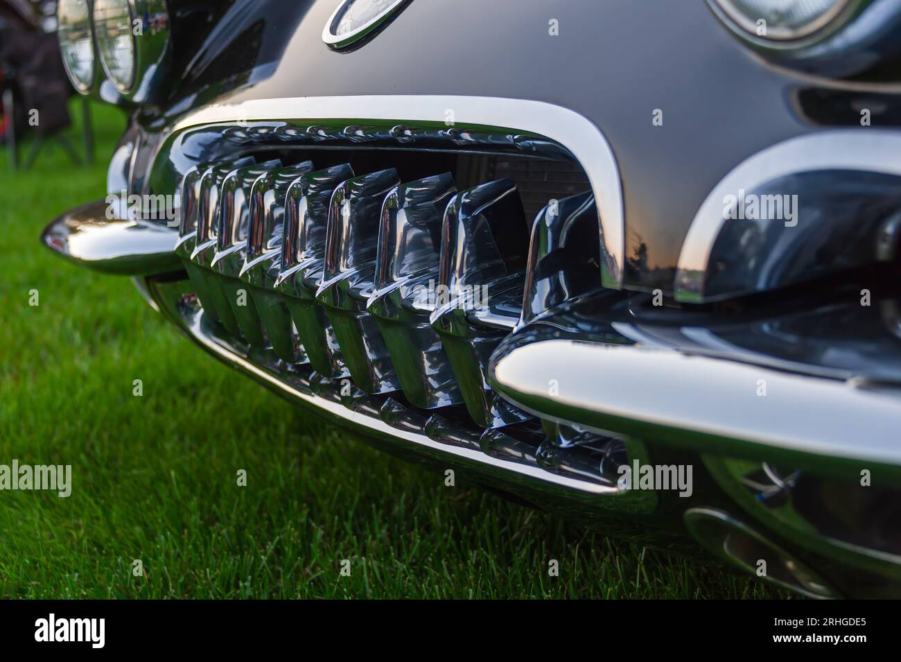 Close-up view of the 9-tooth grille on a 1960 Chevrolet Corvette at a weekly summer evening car show in New England, USA. Stock Photo