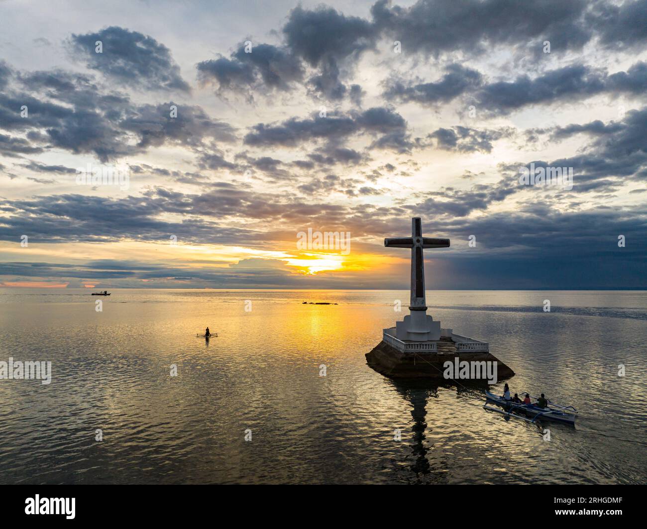 People on the boat floating near the Sunken Cemetery in Camiguin Island. Philippines. Seascape. Stock Photo