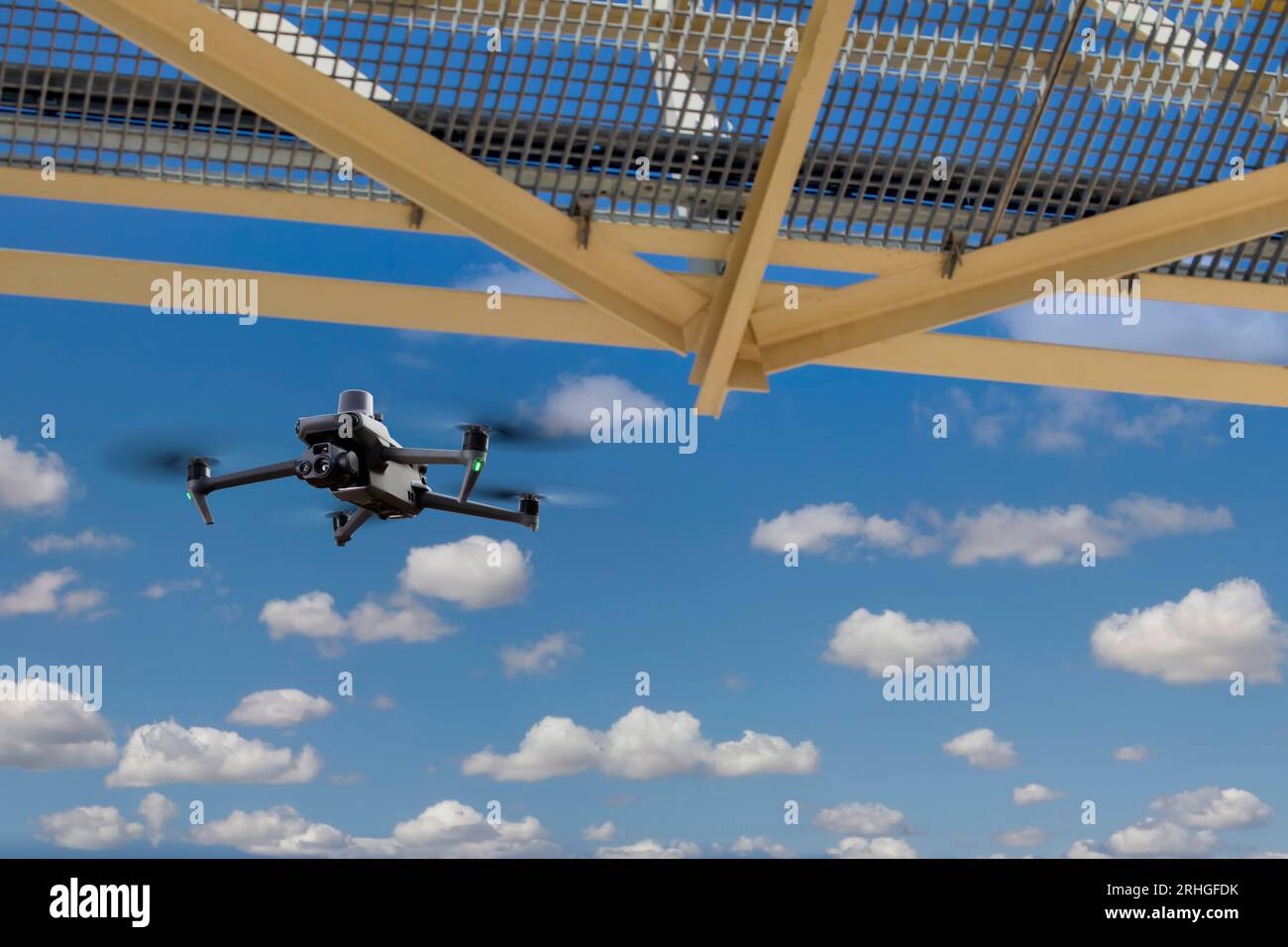 entreprise drone  with RTK module under a bridge doing an inspection Stock Photo