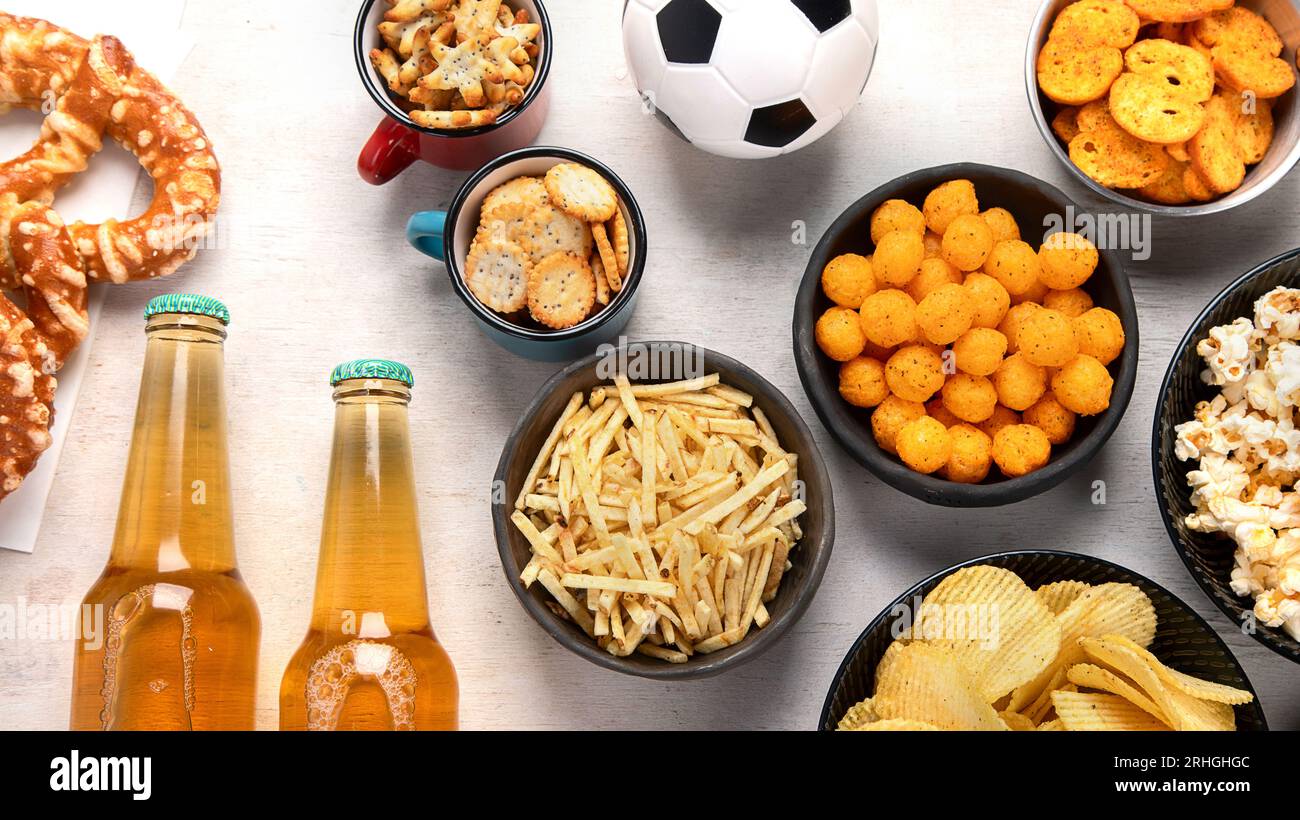 Beer bootles, snacks and ball on table. Top view Stock Photo - Alamy