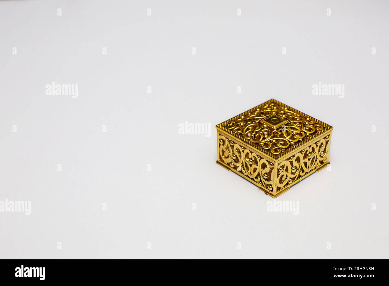 Golden gift box on white background with copy space space Stock Photo ...