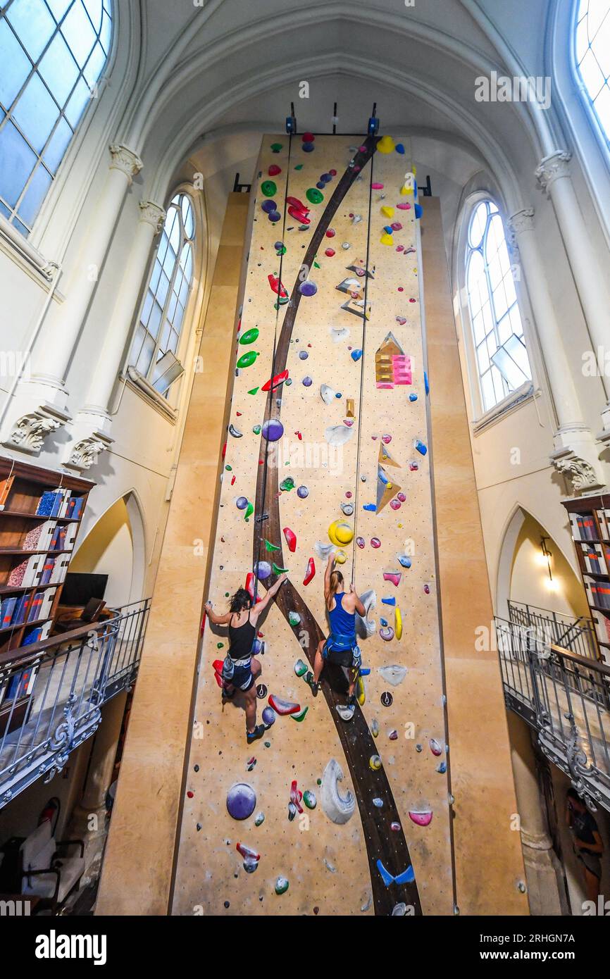 Climbers enjoy the new climbing wall opened by 'Climbing District' in