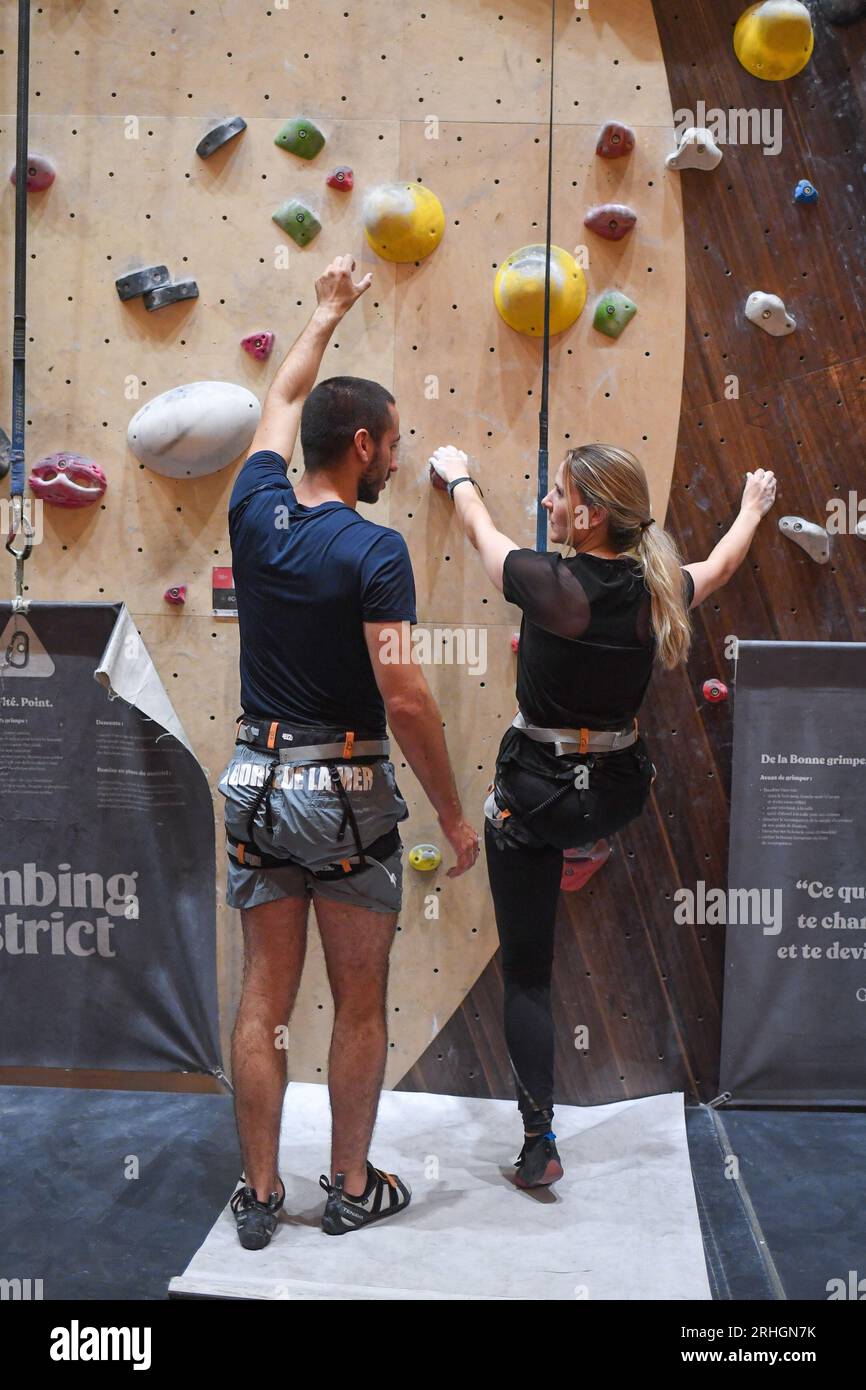 Climbers enjoy the new climbing wall opened by 'Climbing District' in