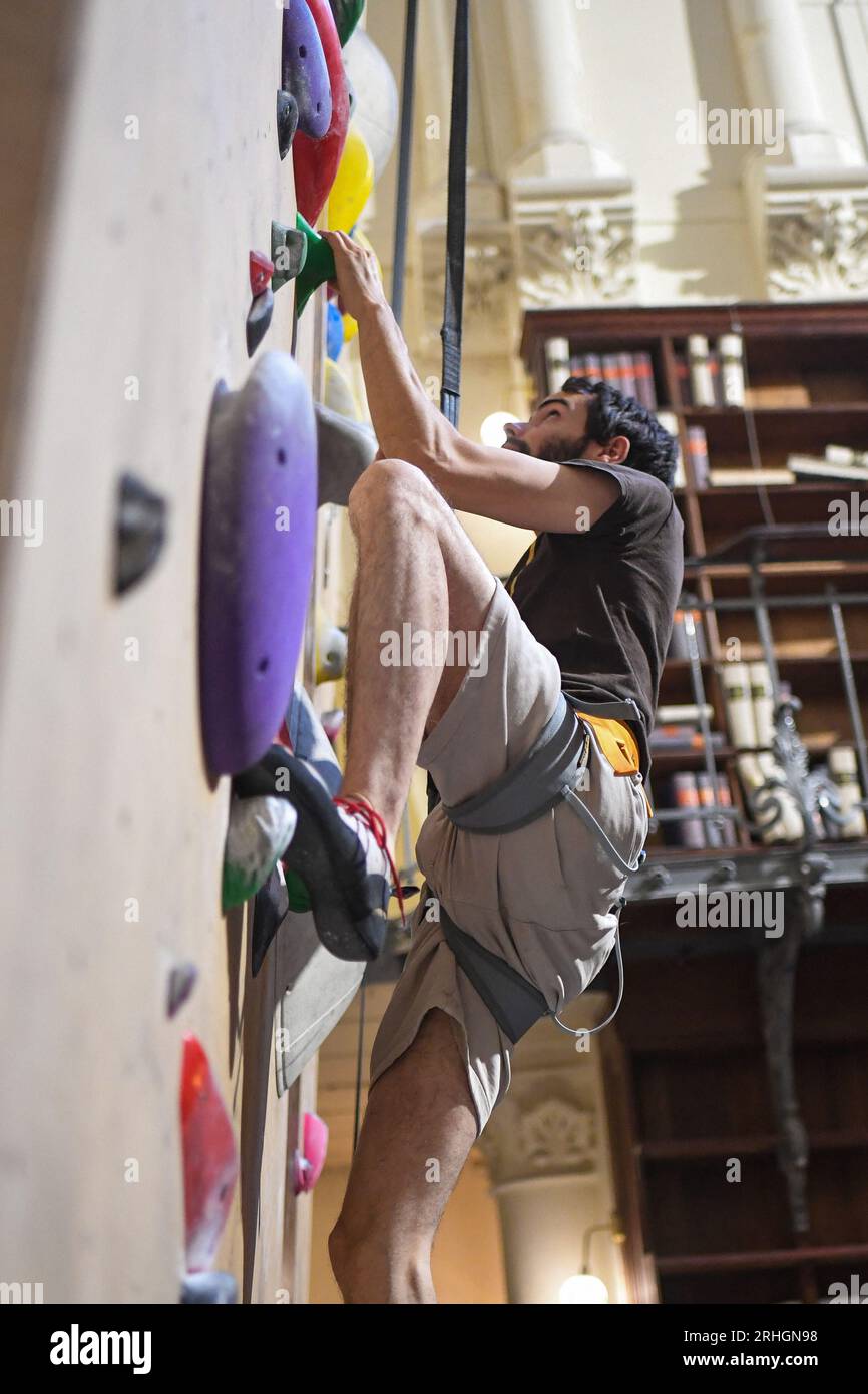Climbers enjoy the new climbing wall opened by 'Climbing District' in