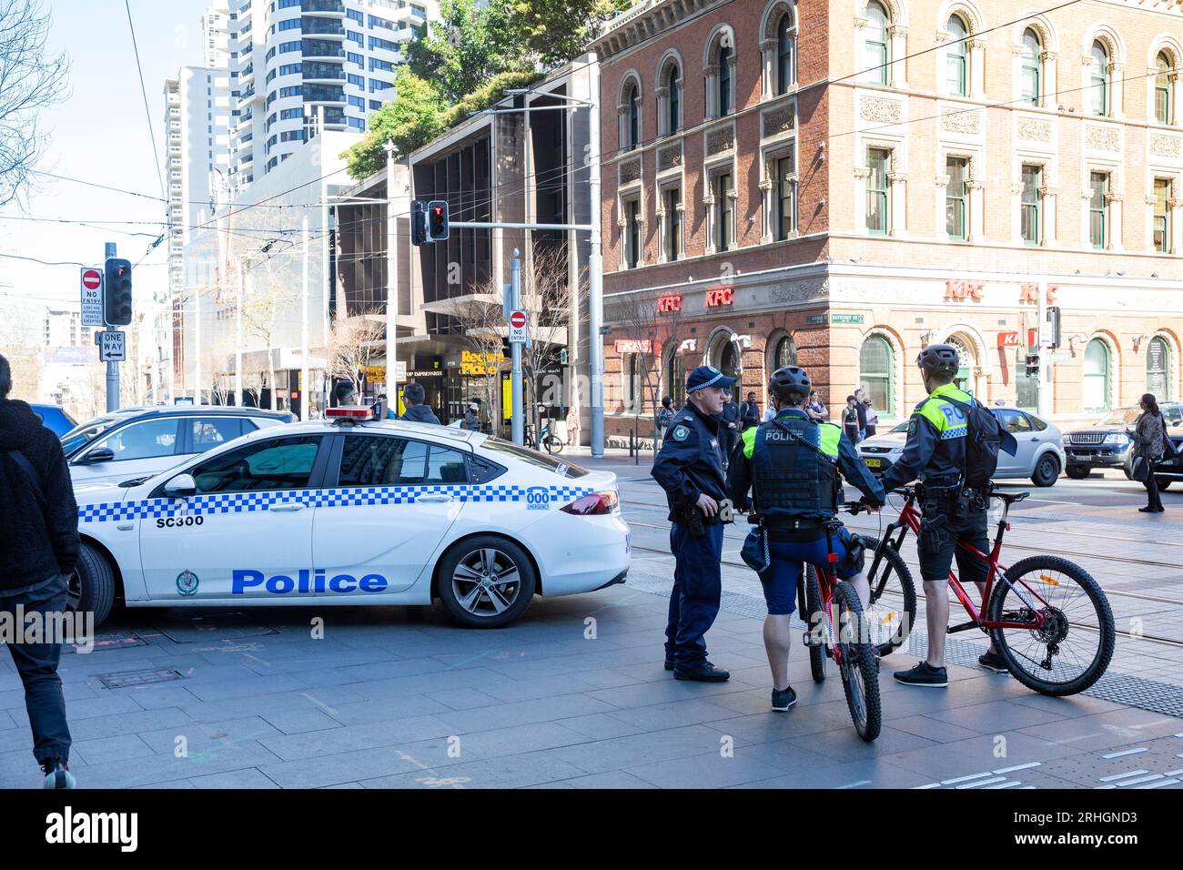 Sydney Australia New South Wales police officers and police car, police officers riding bicycles on police patrol,Australia Stock Photo