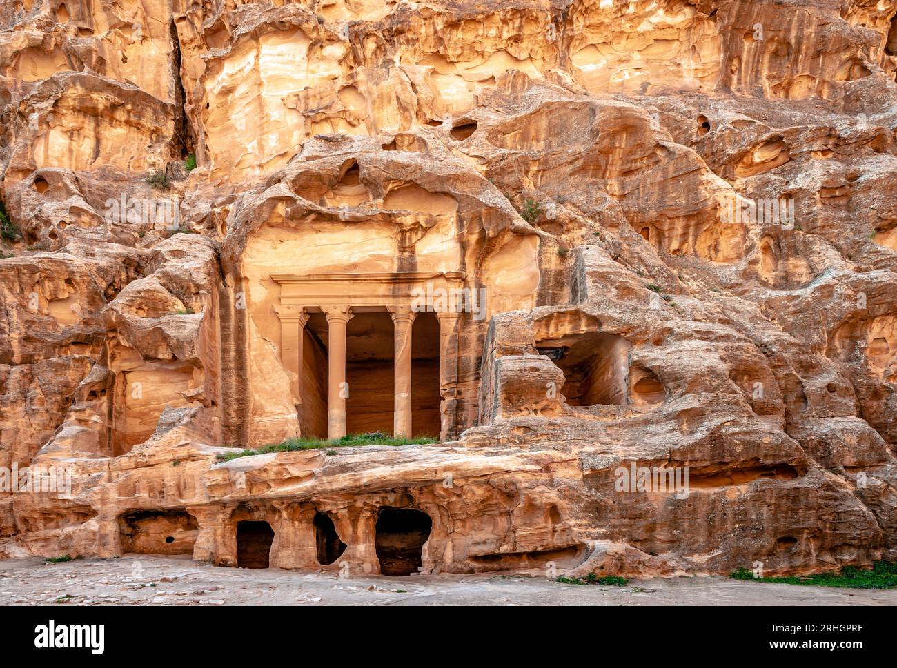 Temple above cave rooms, carved into sandstone in Siq Al-Barid, Little Petra, Jordan. Stock Photo