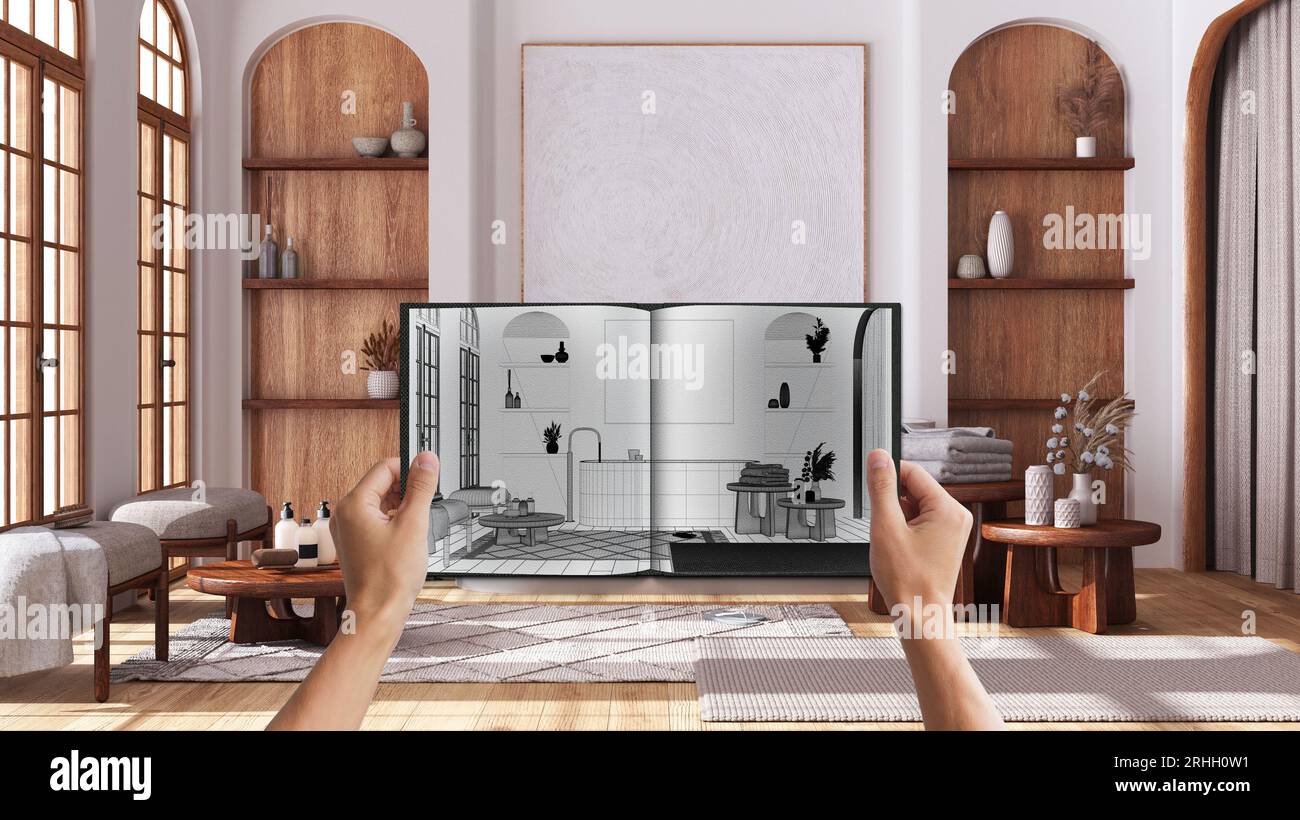 Hands holding notepad with creative bathroom design blueprint sketch or ...