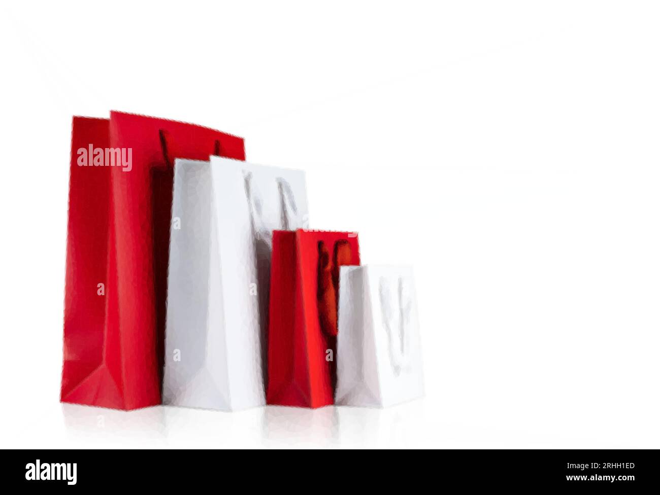 Various sizes of holiday shopping gift bags on isolated white