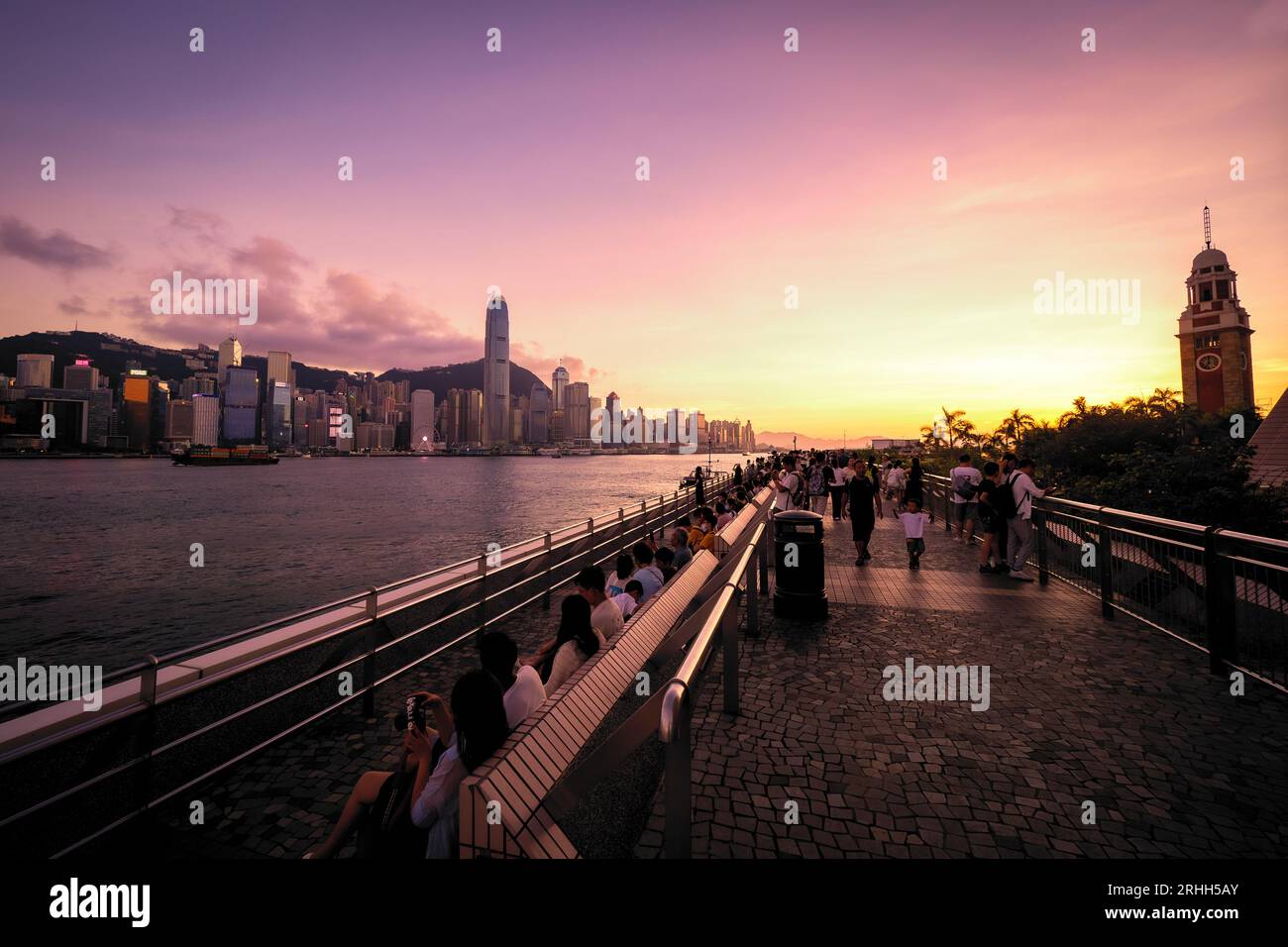 Awesome view of the Avenue of Stars and Hong Kong's fantastic skyline, with its impressive skyscrapers, against a dramatic sunset, Hong Kong, China Stock Photo