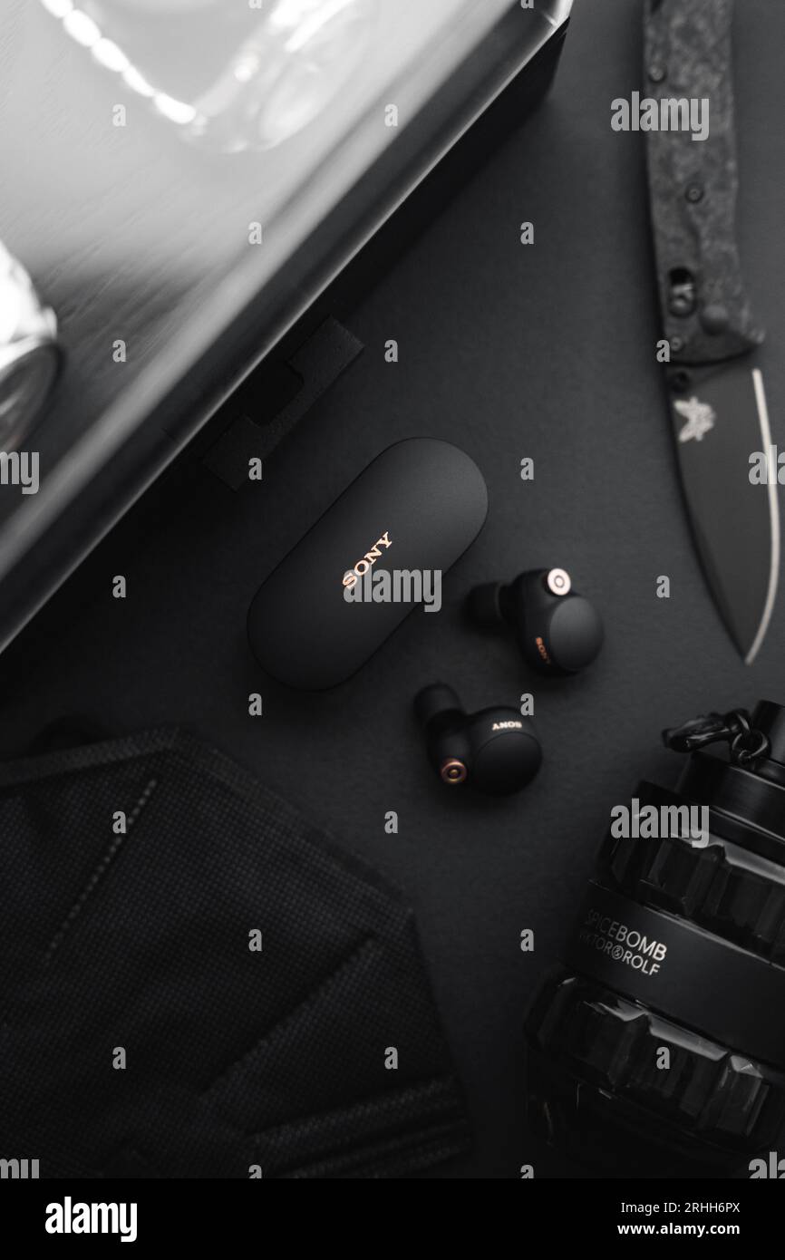 A flatlay photo of a collection of mostly black everyday items Stock ...