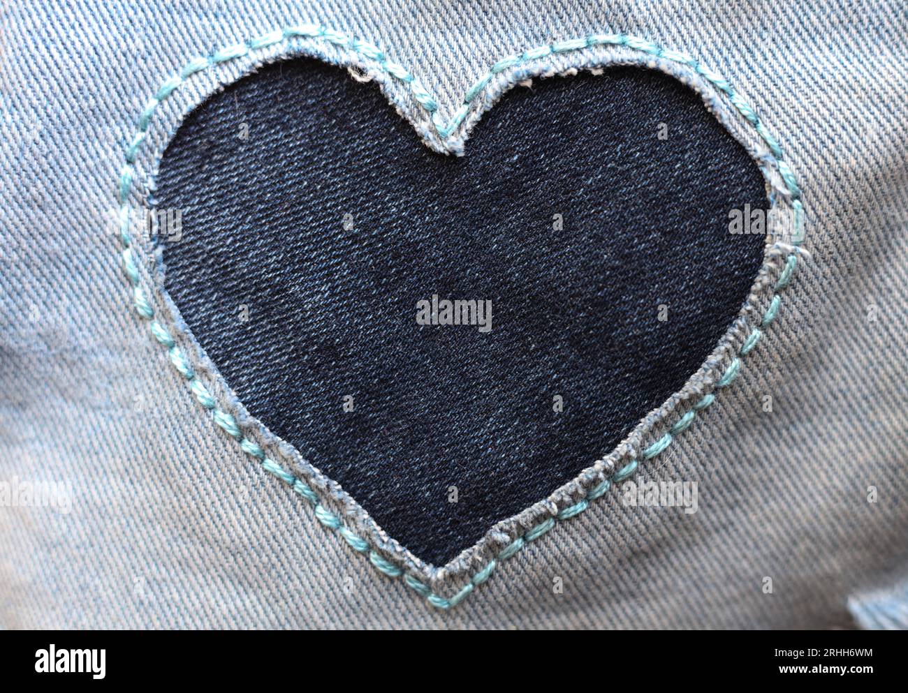 heart shaped patch on jeans fabric Stock Photo