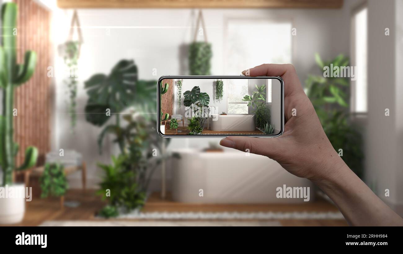 Hand holding smart phone, AR application, simulate furniture and ...