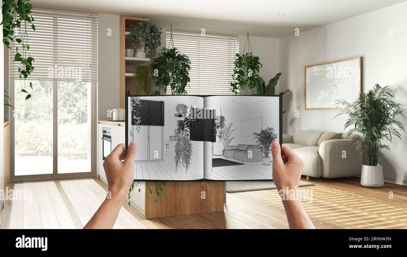 Hands holding notepad with kitchen and living room design blueprint ...