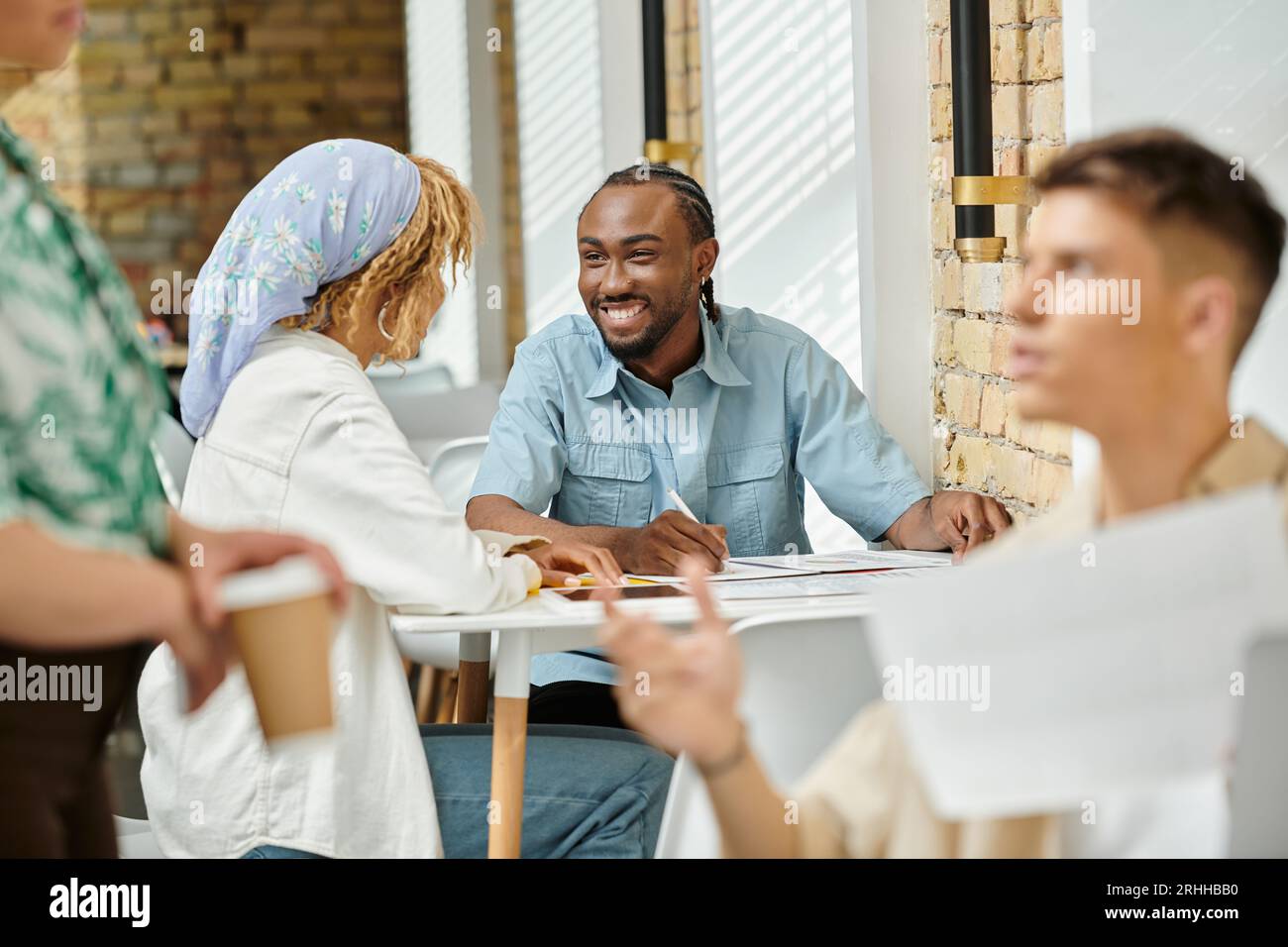 cheerful african american coworkers discussing project over graphs, coworking, start up, ideas Stock Photo