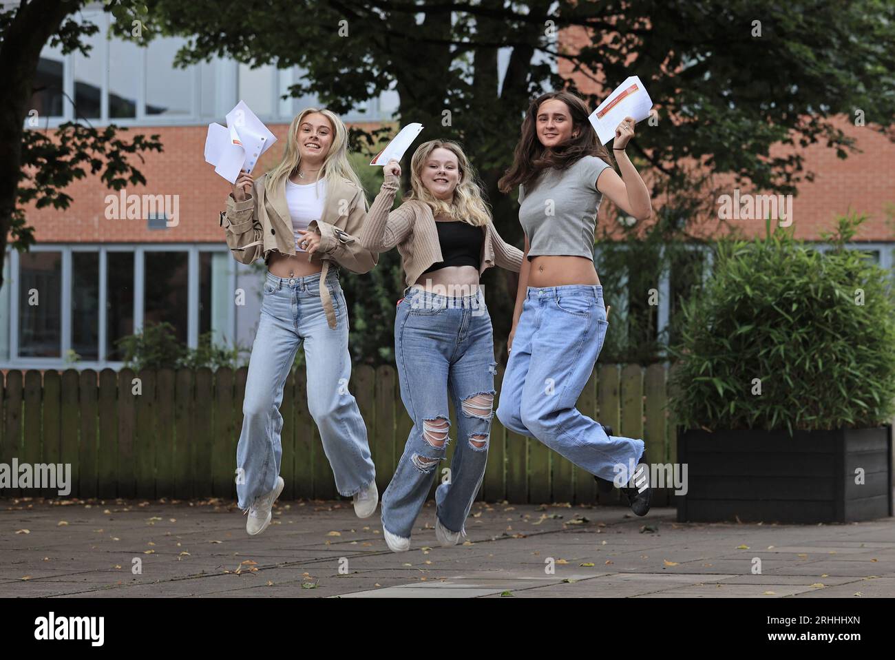 (Left-right) Ruby Devine, Rosemary Polland, and Alice Kelly receive their A-level results at Lagan College, Belfast. Picture date: Thursday August 17, 2023. Stock Photo