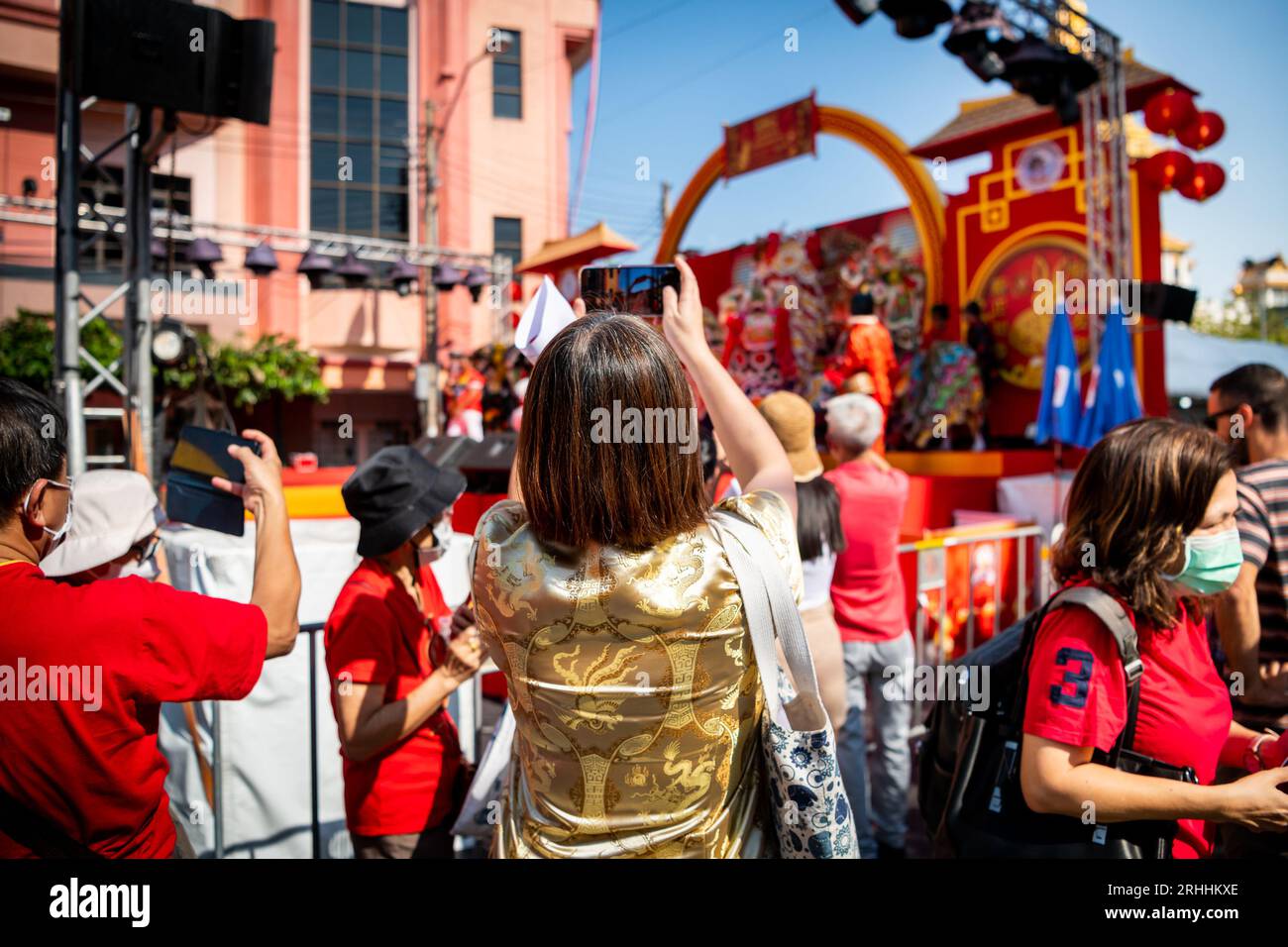 Thai people and tourists busily photograph the dance and singing show celebrating Chinese New Year on Yaowarat Rd. China Town, Bangkok Thailand. Stock Photo