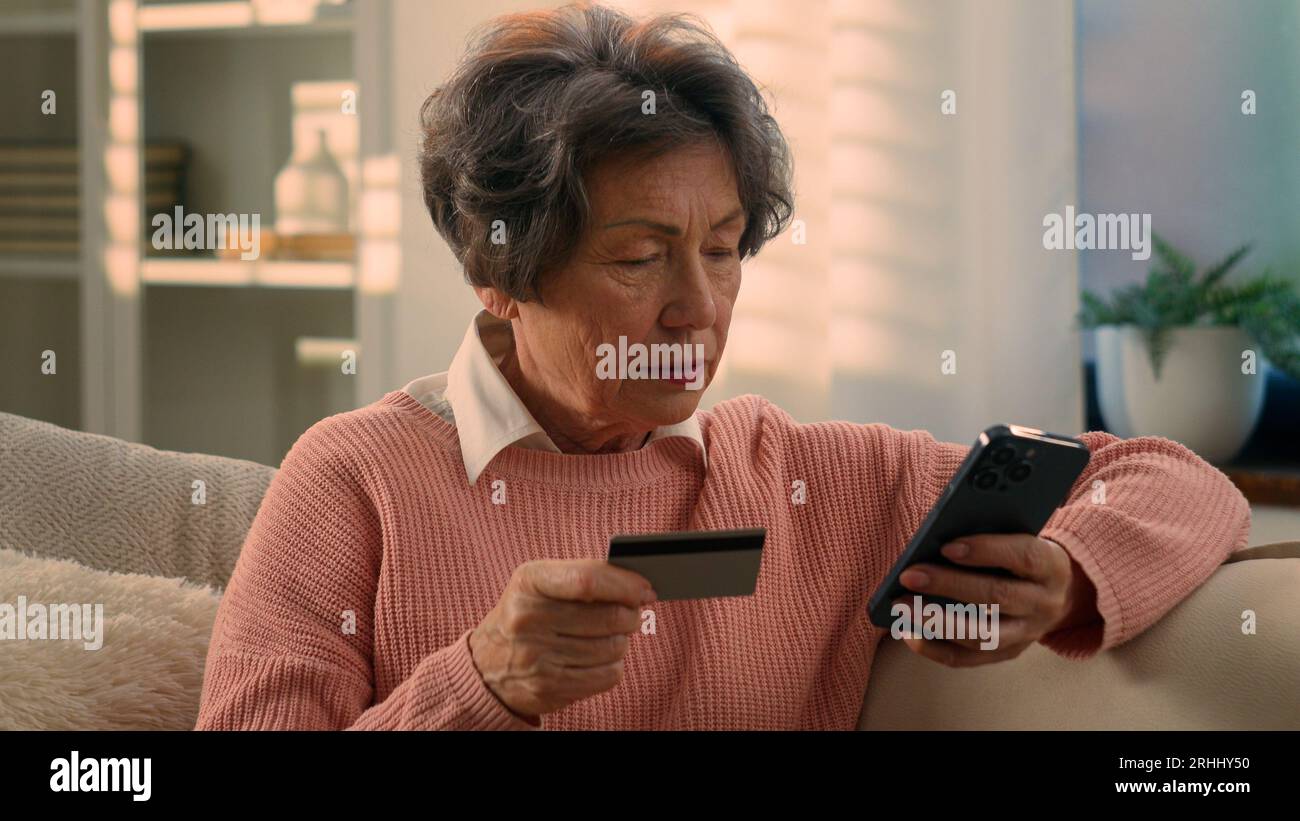 Elderly stylish granny caucasian mature woman using app on smartphone for  online shopping confused face expression. Chroma key background. Old  grandmother in fashion wearing browsing on mobile phone Stock Photo - Alamy