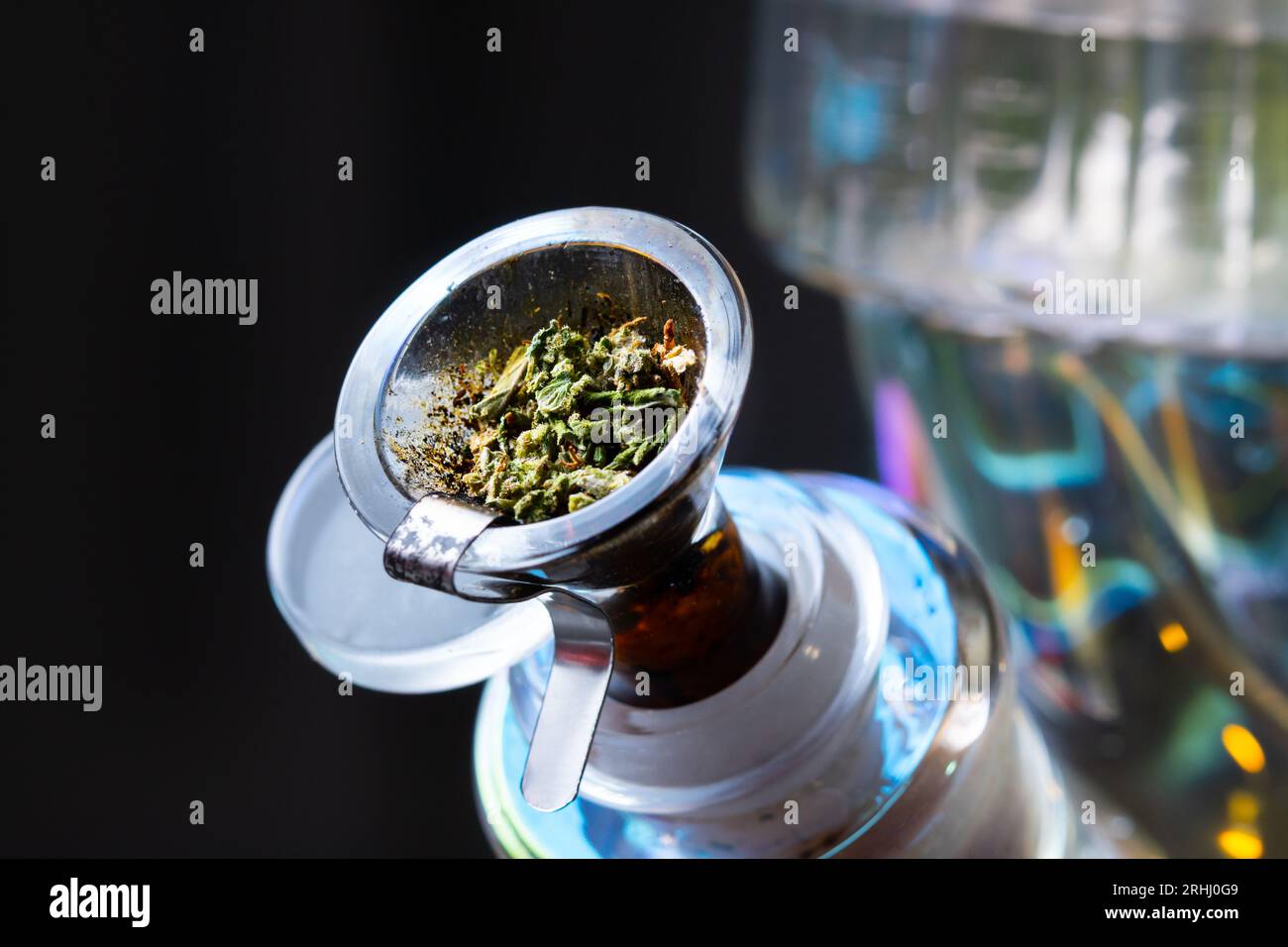 Macro close up smoking medical marijuana bud with bong. Accessories for  smoke weed Stock Photo - Alamy