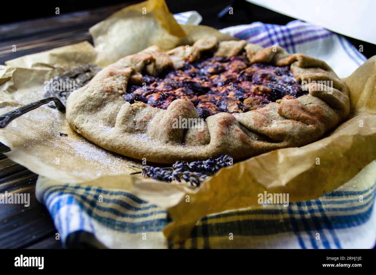 Food photography of dessert course with delicious plums, pie crust in vintage style Stock Photo