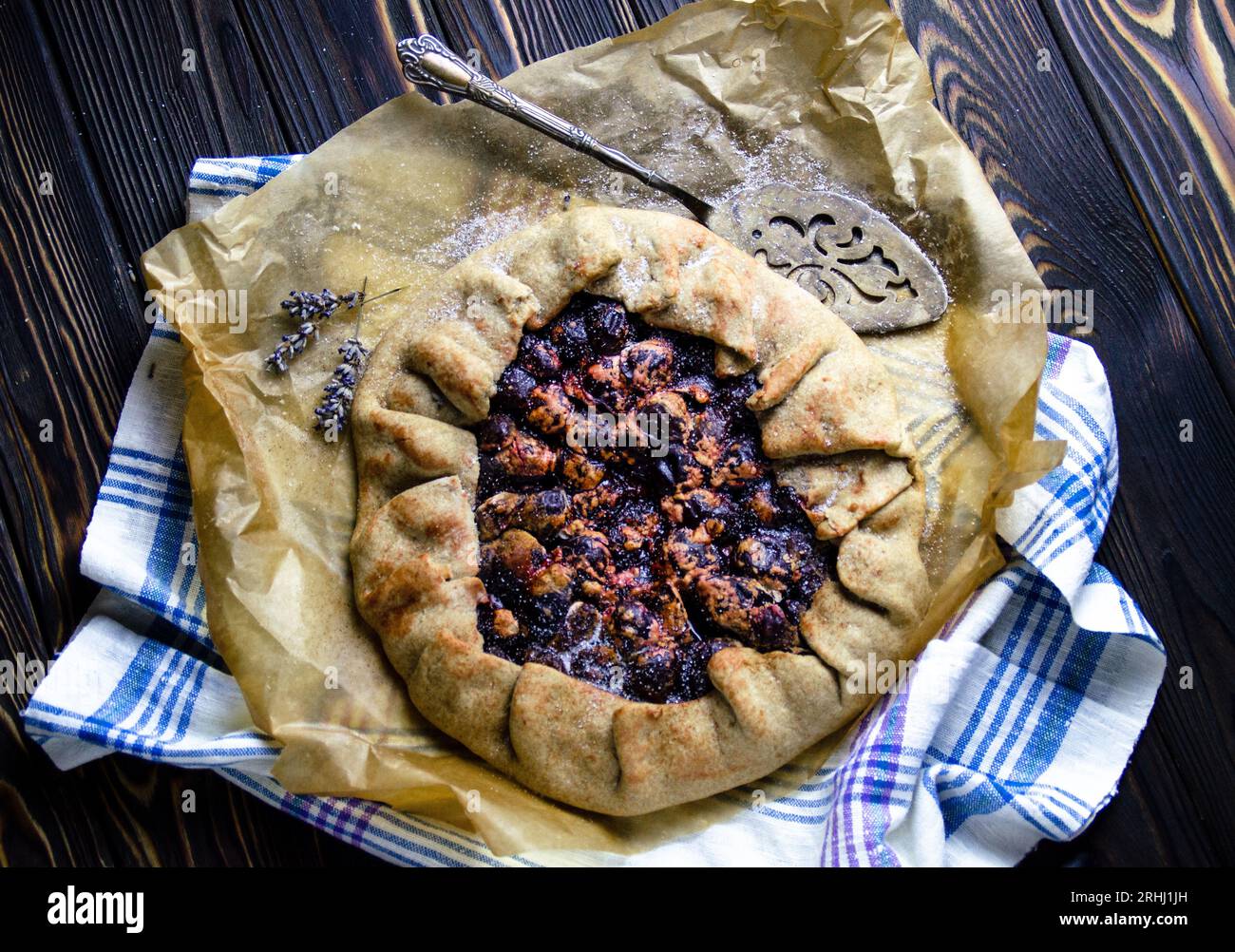Food photography of dessert course with delicious plums, pie crust in vintage style Stock Photo