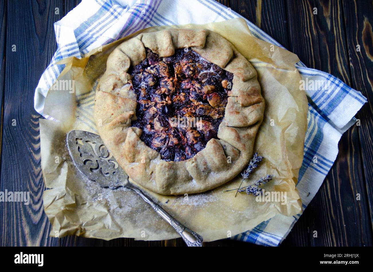 Food photography of dessert course with delicious plums, pie crust in vintage style Stock Photo