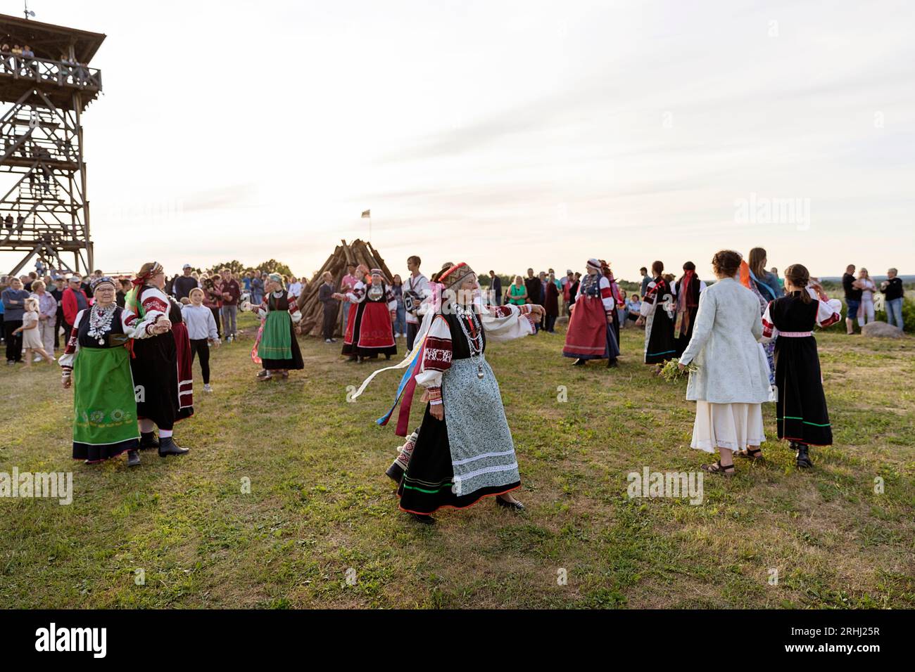 Estonians in traditional seto estonian costumes dancing, celebrating estonian national holiday 