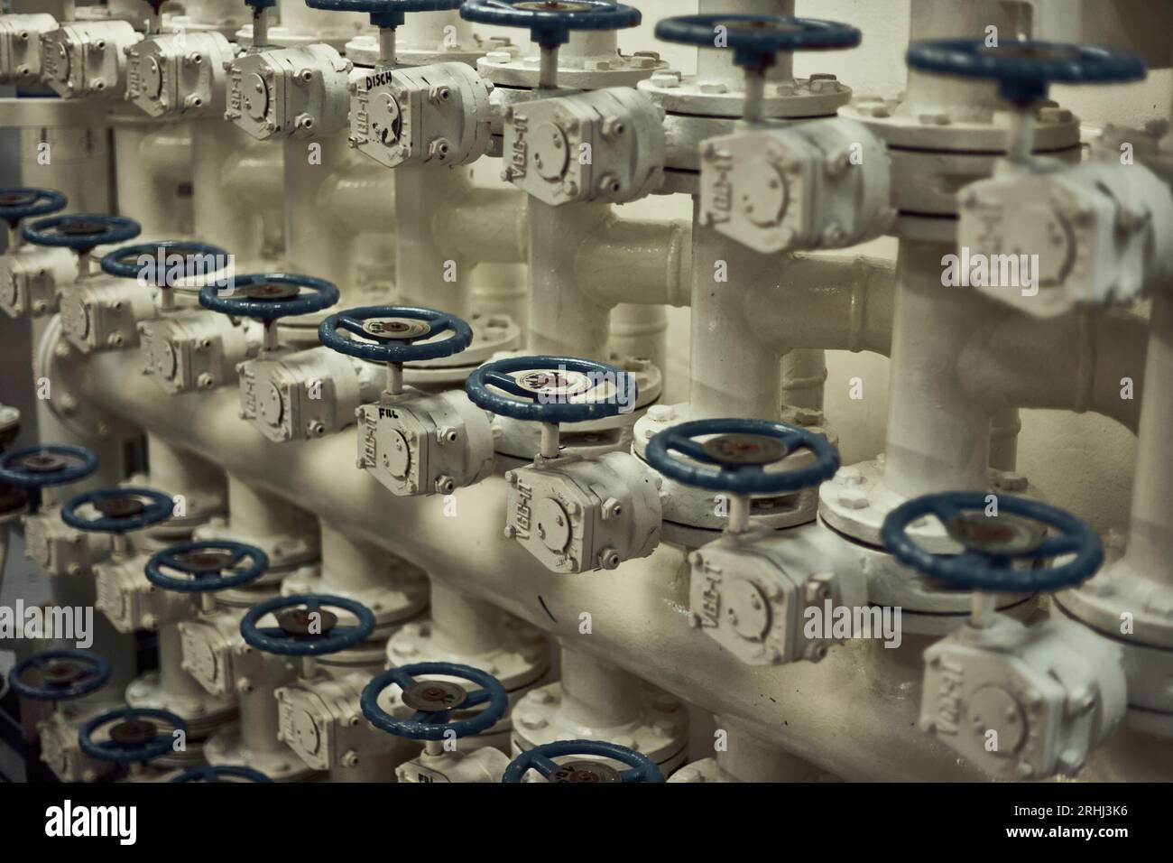 Butterfly valves manifold in engine room for fuel oil transfer cargo operations with blue valve