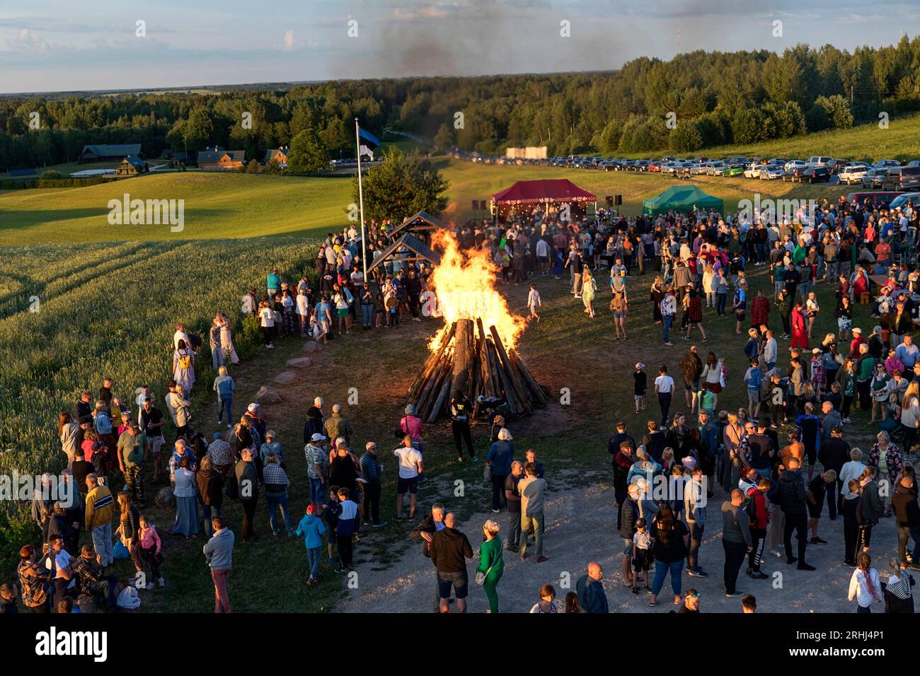 Locals on a hill near Meremäe Viewing Tower celebrating estonian national holiday called Jaanipaev or leedopaev around bonfire, Seto country, Estonia Stock Photo