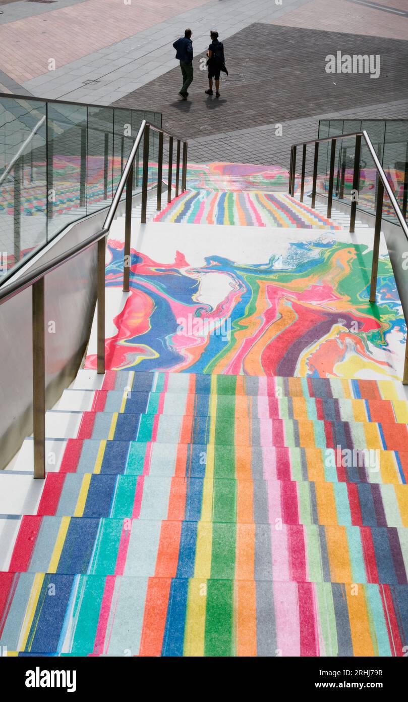 Rainbow waterfall effect on steps near the O2 Arena Dome in Greenwich London UK Stock Photo