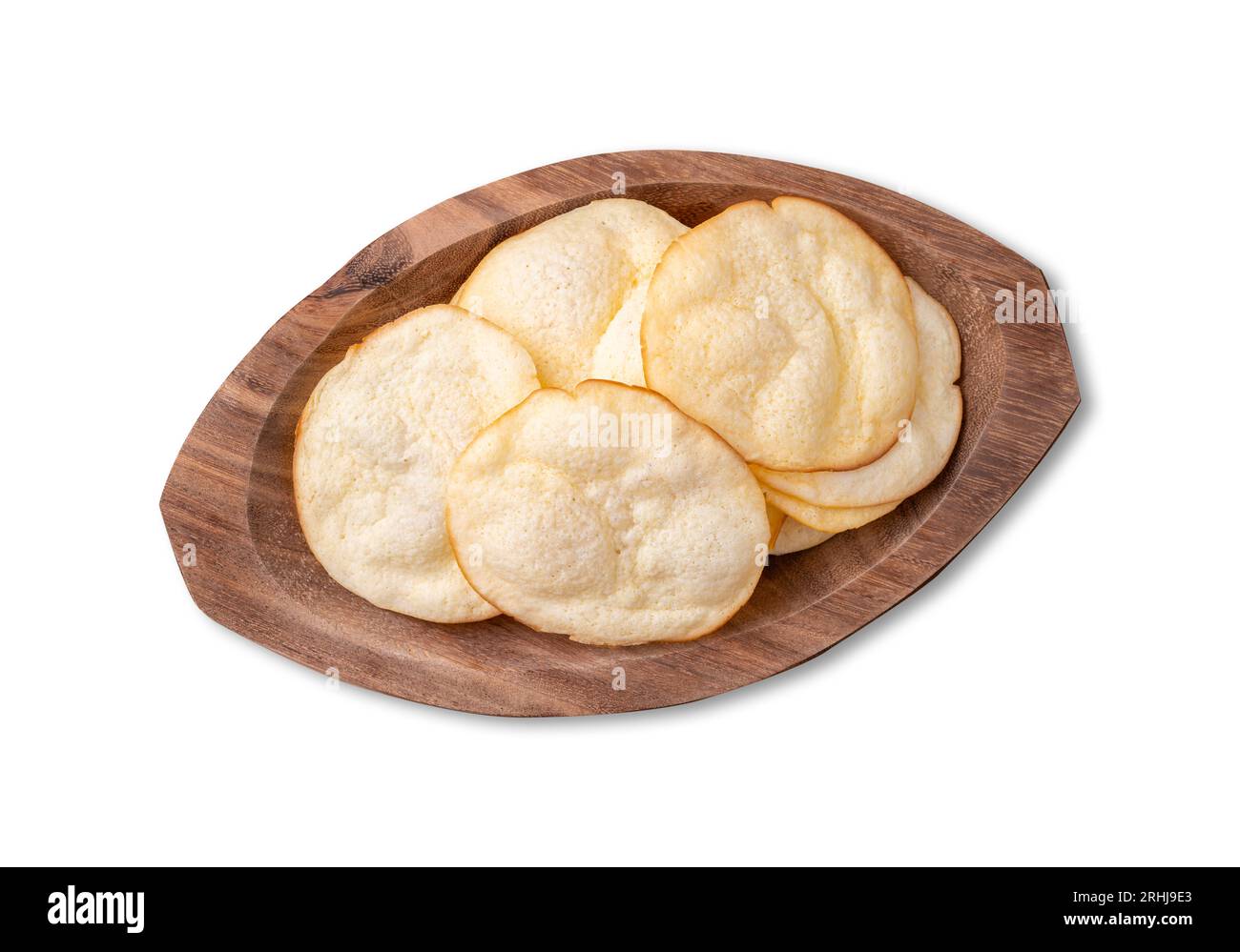 Smoked provolone cheese chips in a bowl isolated over white background. Stock Photo