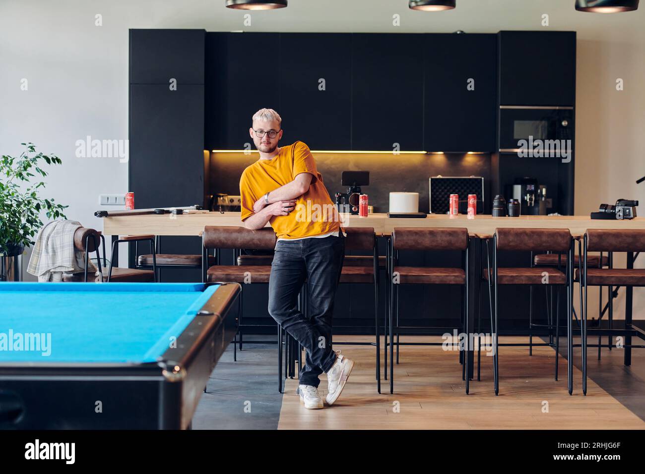 A man takes a brief rest from work in a modern startup coworking center ...