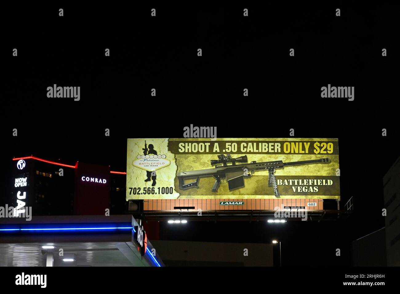 Las Vegas, Nevada, USA. 10th Aug, 2023. A billboard advertises shooting a .50 caliber machine gun at Battlefield Vegas is seen on August 10, 2023 in Las Vegas, Nevada. The gun range that caters to tourists features over 1,000 different weapons at their range and outdoor military museum. (Credit Image: © David Becker/ZUMA Press Wire) EDITORIAL USAGE ONLY! Not for Commercial USAGE! Stock Photo