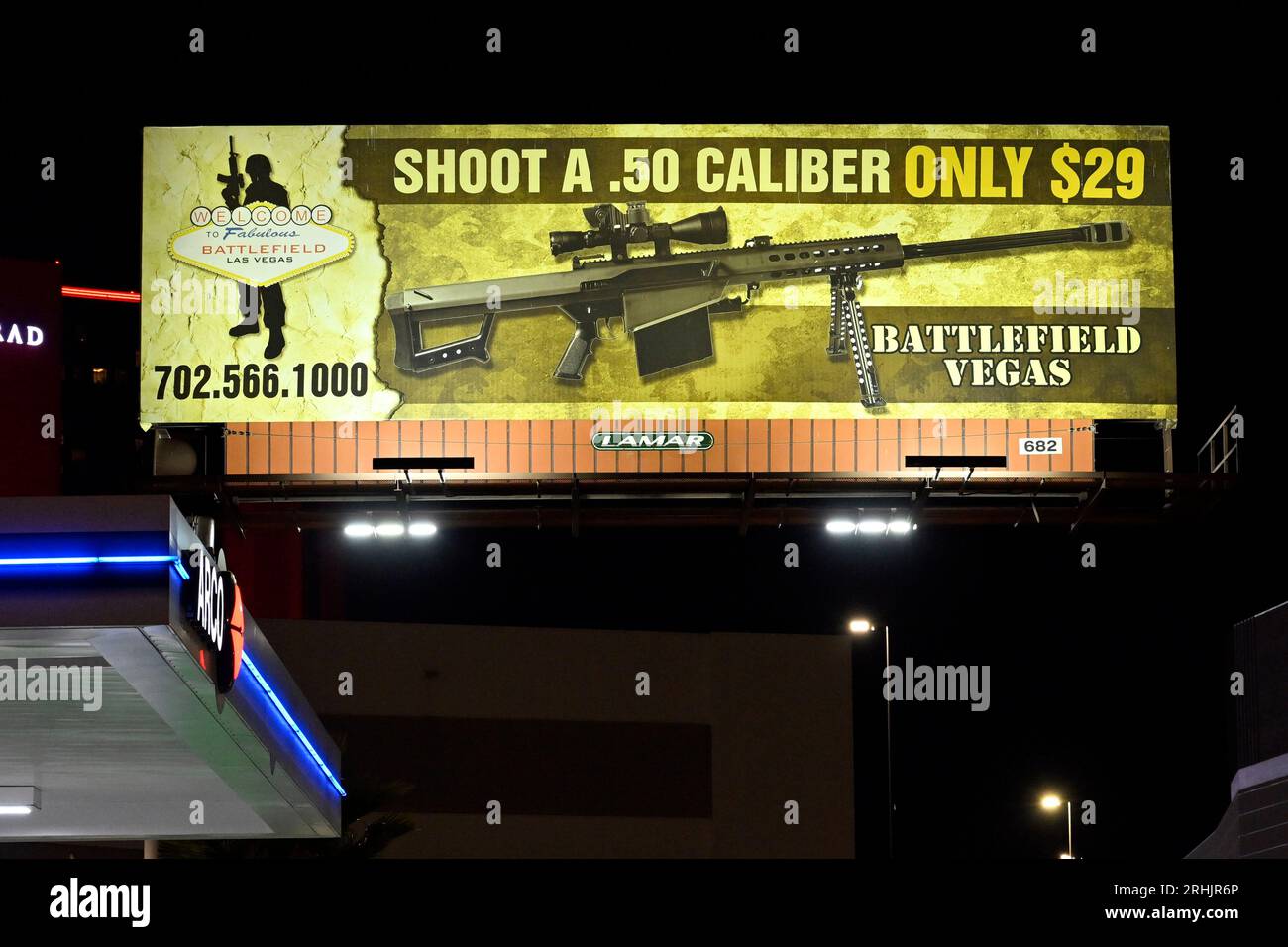 Las Vegas, Nevada, USA. 10th Aug, 2023. A billboard advertises shooting a .50 caliber machine gun at Battlefield Vegas is seen on August 10, 2023 in Las Vegas, Nevada. The gun range that caters to tourists features over 1,000 different weapons at their range and outdoor military museum. (Credit Image: © David Becker/ZUMA Press Wire) EDITORIAL USAGE ONLY! Not for Commercial USAGE! Stock Photo