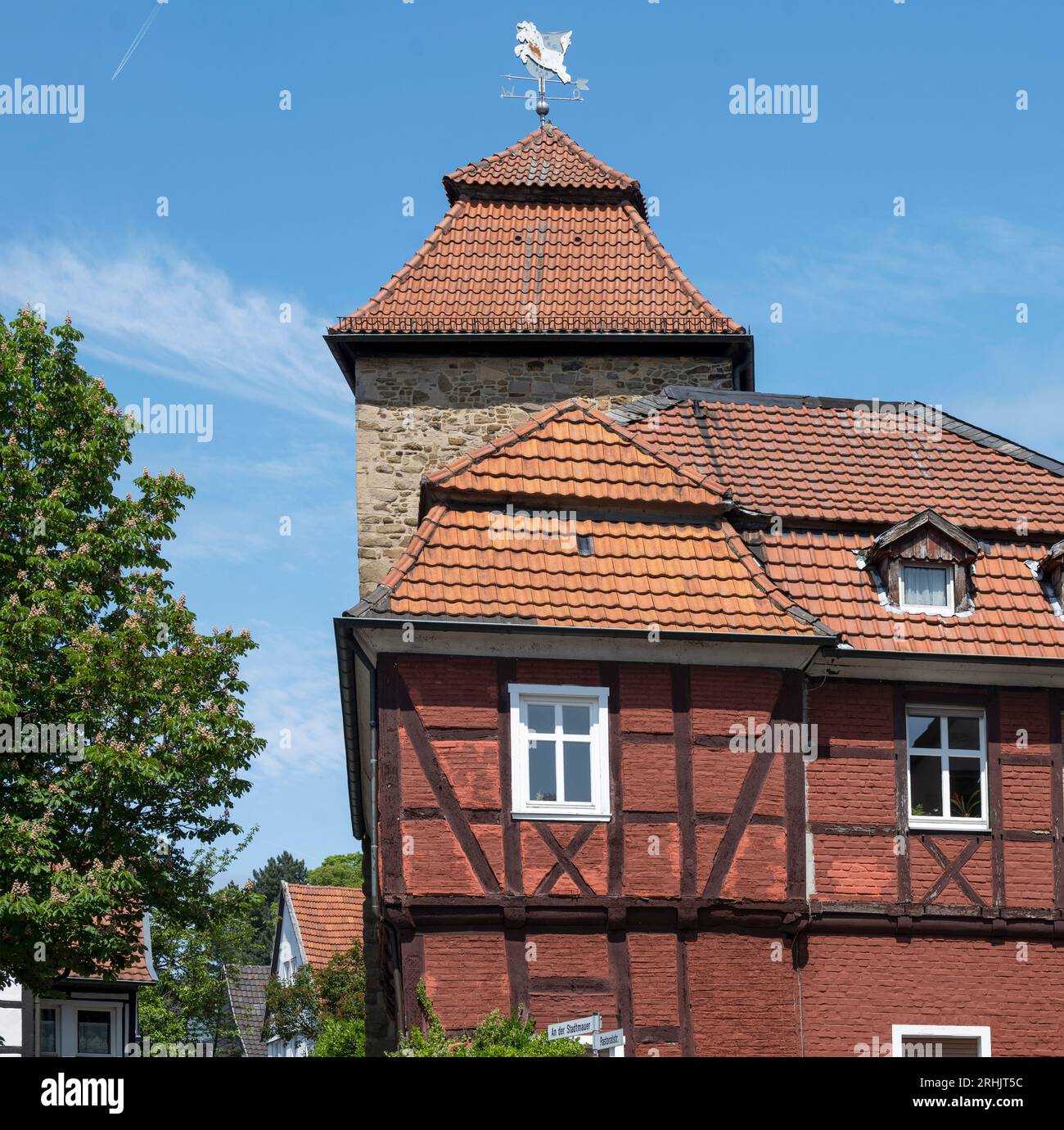 Deutschland, NRW, Märkischer Kreis, Menden, ehemalige Seilerei, dahinter der Teufelsturm Stock Photo