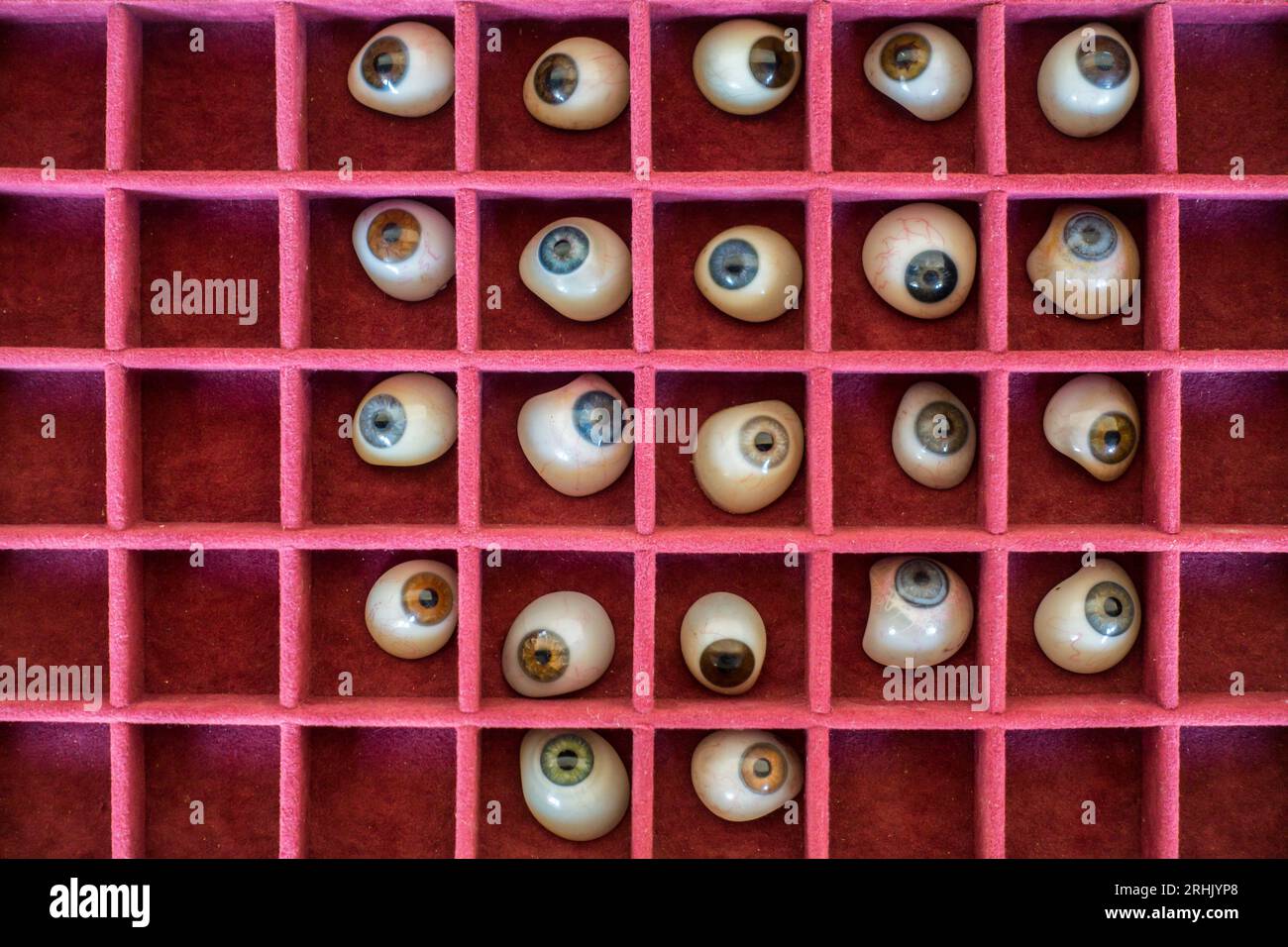 Case with assortment human glass eyes / artificial eyes / ocular prostheses from the early 20th century Stock Photo