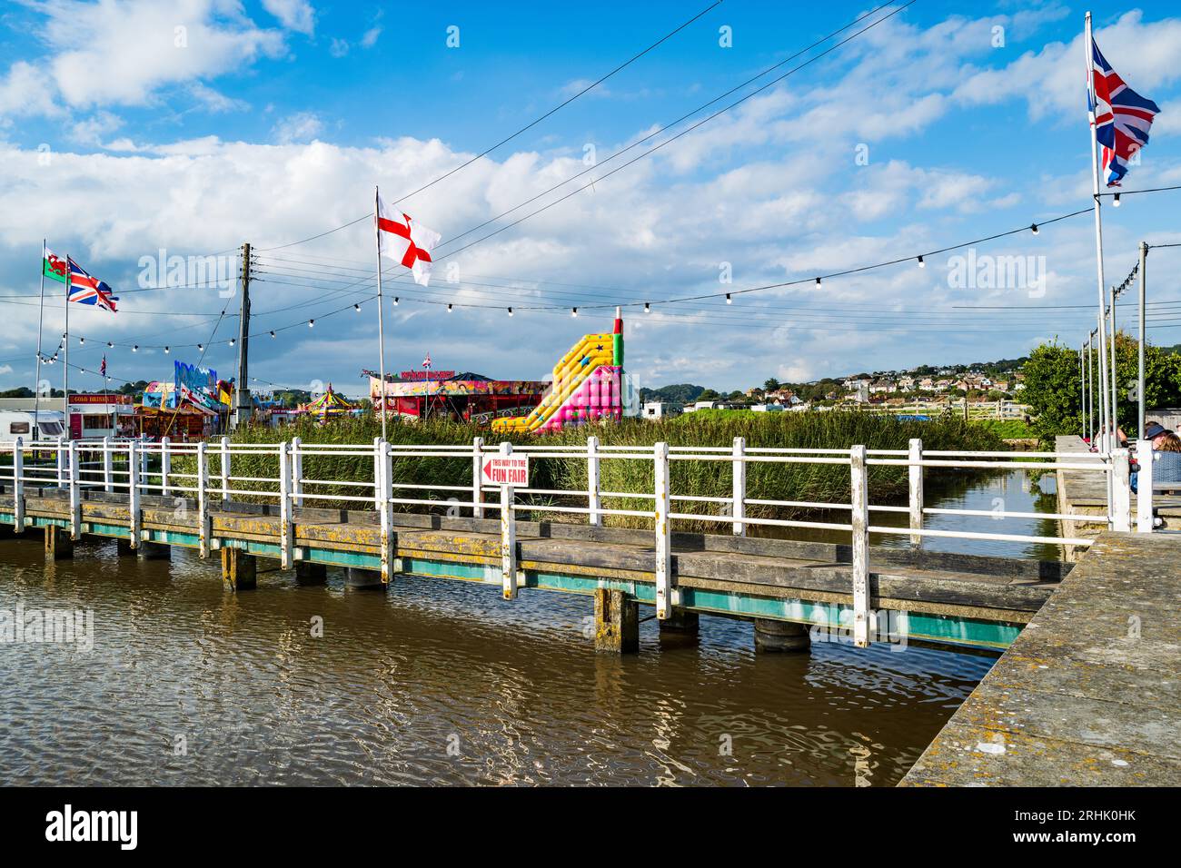 Seaside funfair and amusements  in West Bay harbour, Dorset, Traditional British seaside. British vacation. Culture. Stock Photo