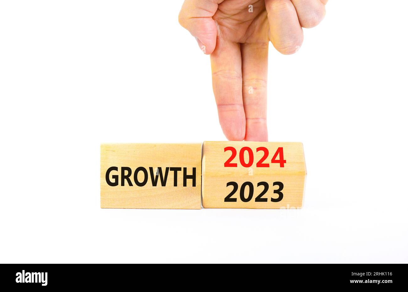 Planning 2024 growth new year symbol. Businessman turns a wooden cube