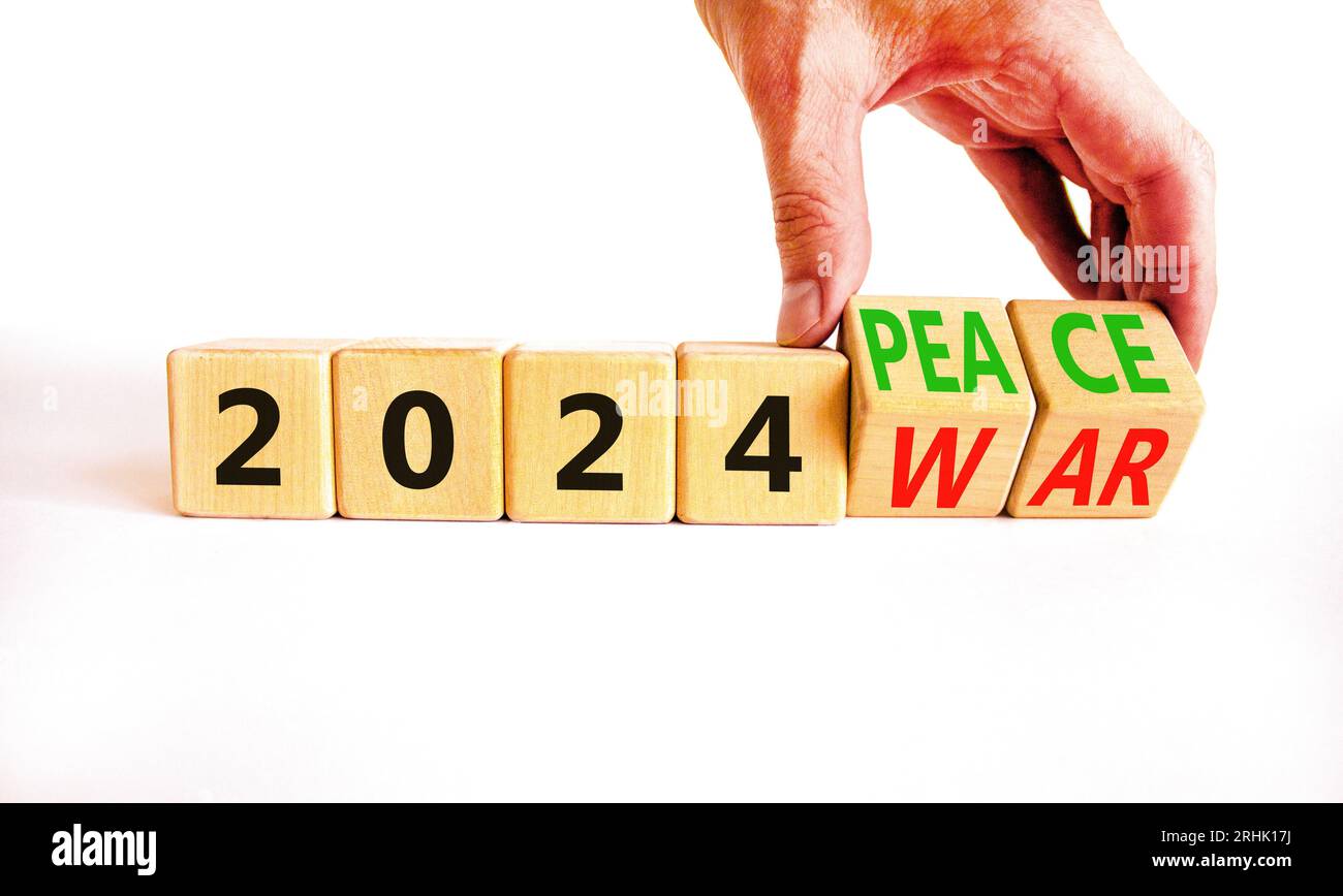 2024 war or peace symbol. Businessman turns a wooden cube and changes