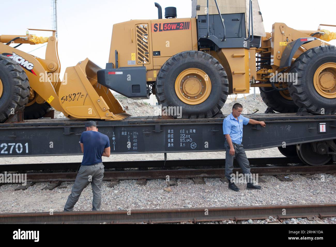 Guards take inventory of goods crossing by train from China into Kazakhstan at the Khorgos Special Economic Zone. Some goods will be shipped on to Eur Stock Photo
