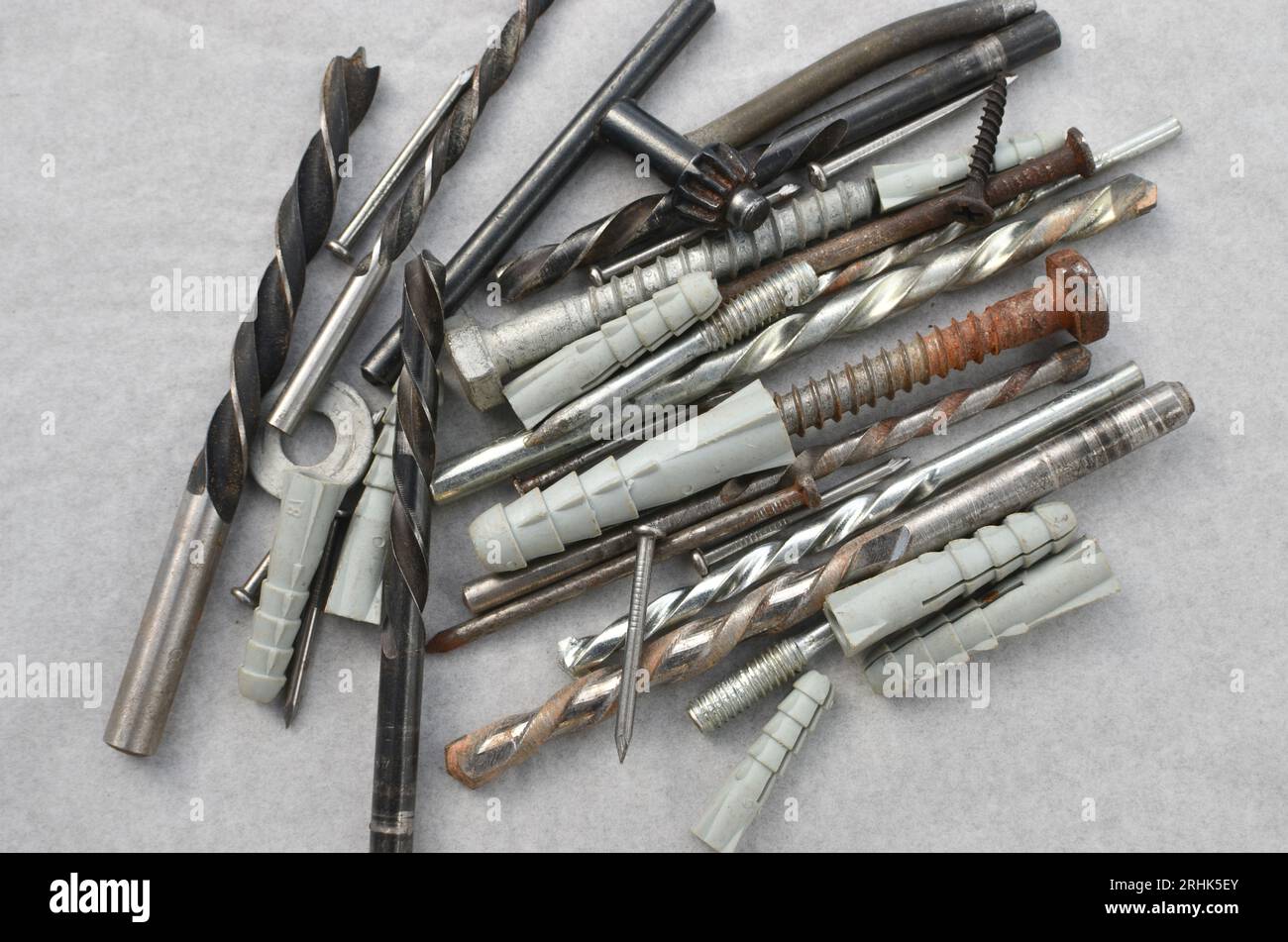 Closeup of drill bits with screws ready for work, representing