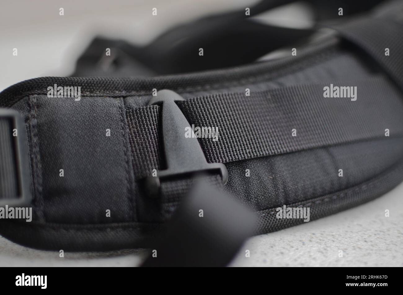 Black suspender or belt close-up, elegant and high-quality accessory to complete your style. Concept for backpacks or military accessories. Stock Photo