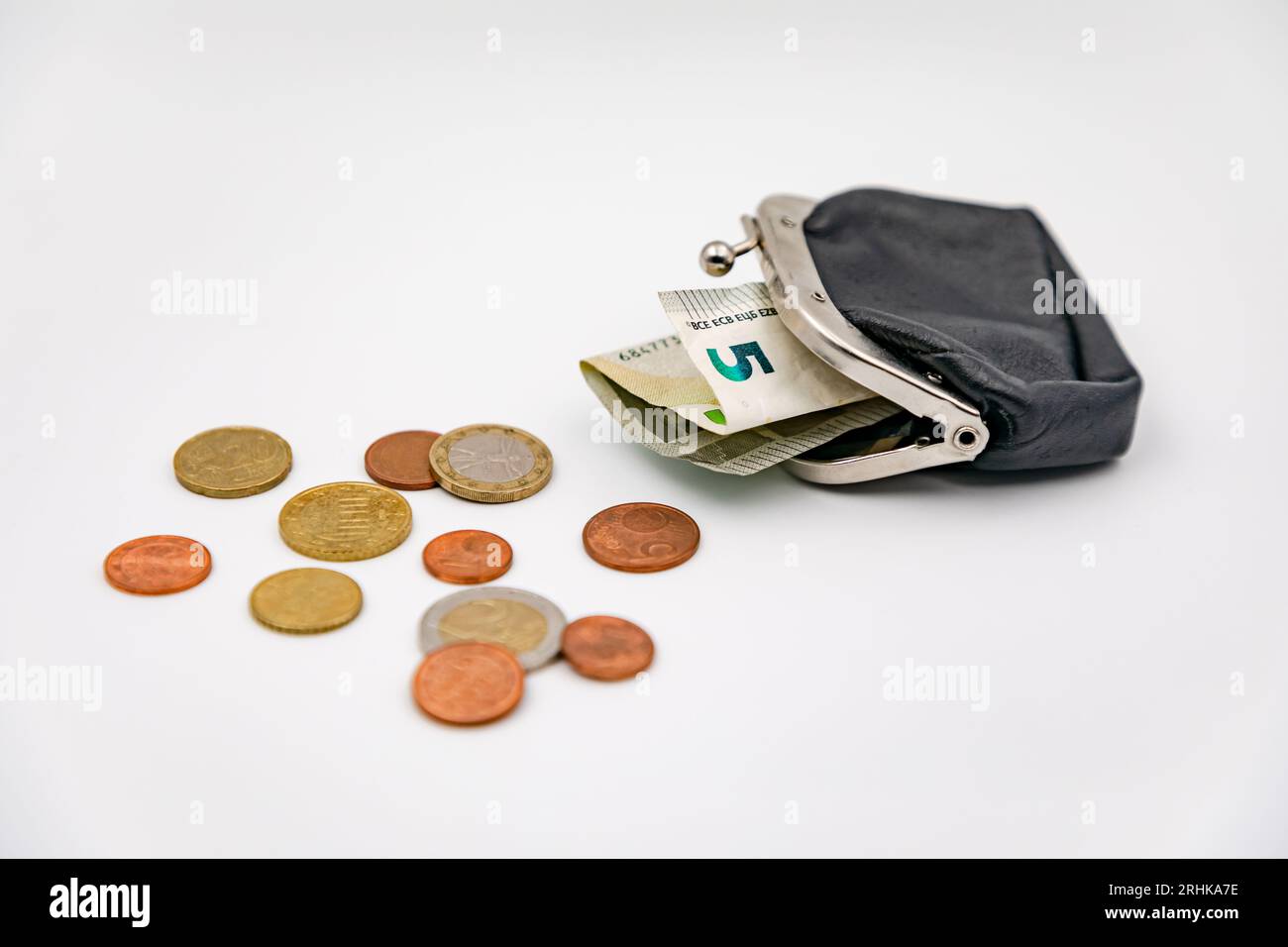 Exchange with euro coins and 5 euro bills, also known as money, small