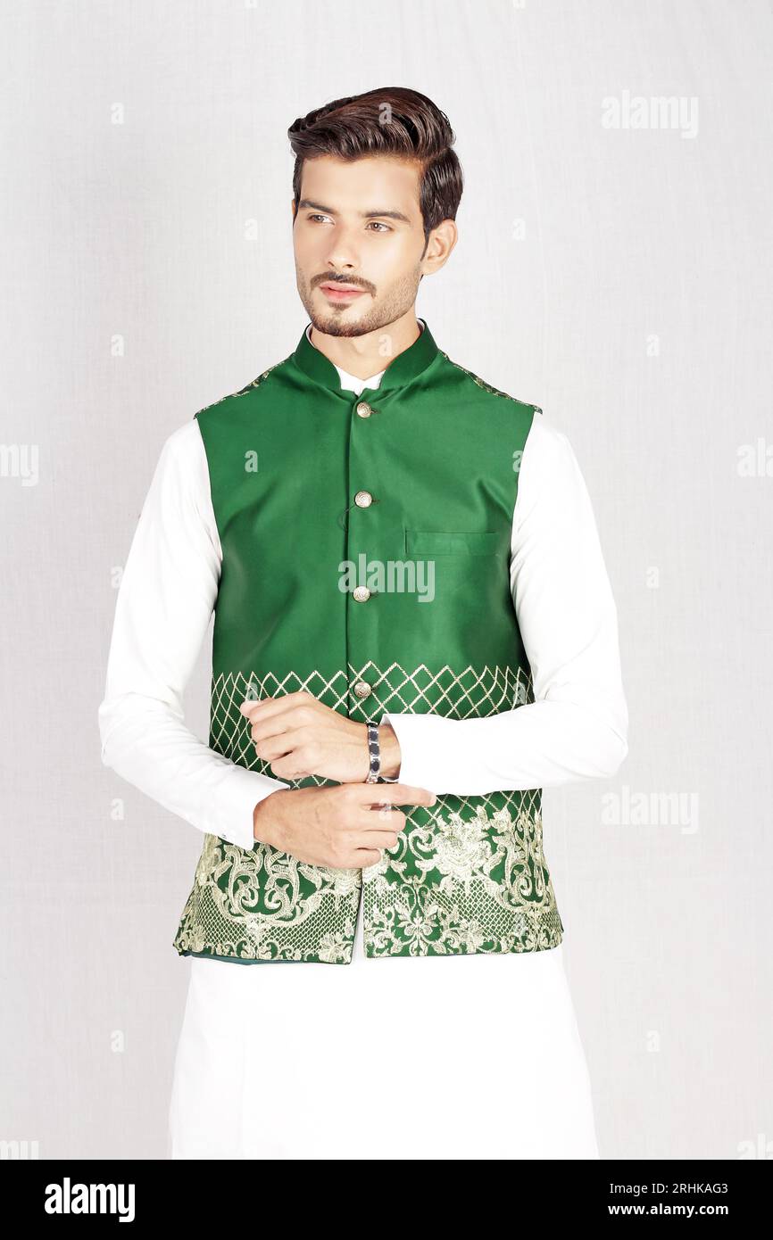 MALE MODEL POSING IN PAKISTANI TRADATIONAL DRESS Stock Photo