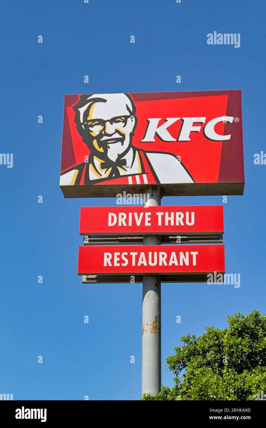 Mdina, Malta -4 August 2023: Large sign for a drive thru restaurant operated by the Kentucky Fried Chicken KFC isolated against a deep blue sky Stock Photo