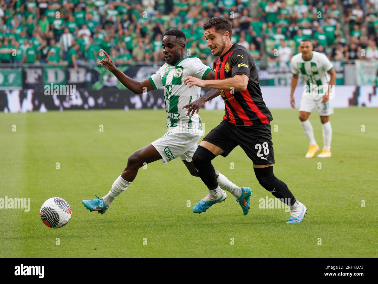 BUDAPEST, HUNGARY - AUGUST 29: (l-r) Tokmac Chol Nguen of Ferencvarosi TC  celebrates his goal in front of Gergo Lovrencsics of Ferencvarosi TC during  the UEFA Europa League Play-off Second Leg match