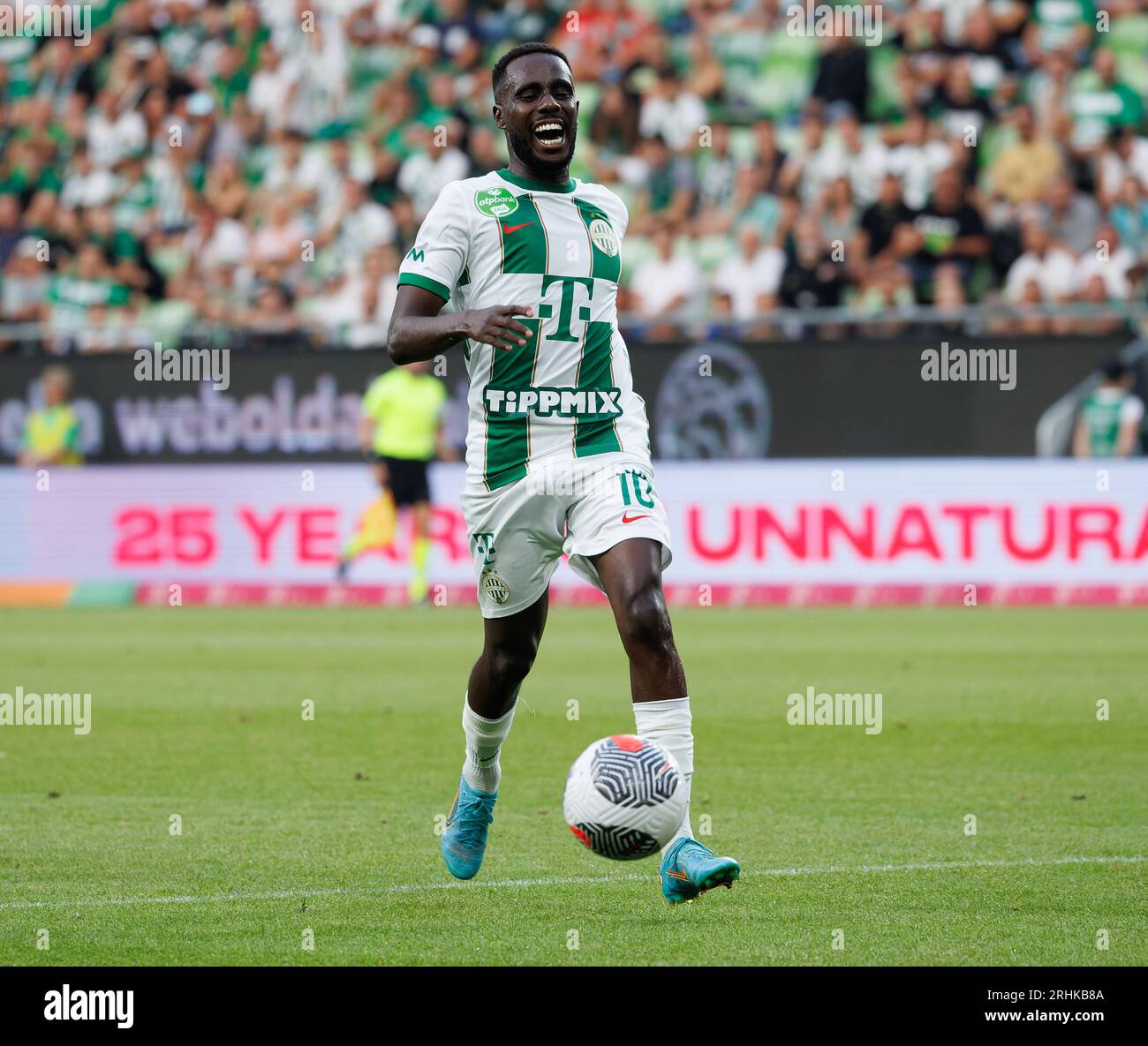 BUDAPEST, HUNGARY - MAY 4: Ihor Kharatin of Ferencvarosi TC #14 blocks the  shot from Vincent Onovo of Ujpest FC (l) before Tokmac Chol Nguen of Ferencvarosi  TC #92 during the Hungarian